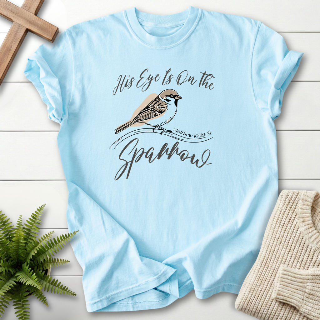 Chambray women's Christian t-shirt with bird illustration and "His Eye Is on the Sparrow" script