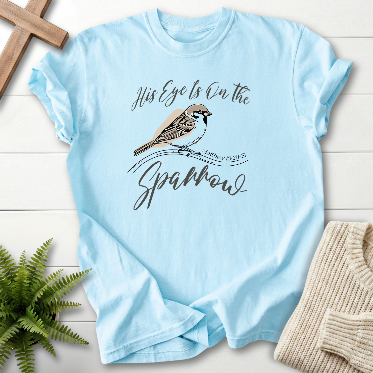 Chambray women's Christian t-shirt with bird illustration and "His Eye Is on the Sparrow" script