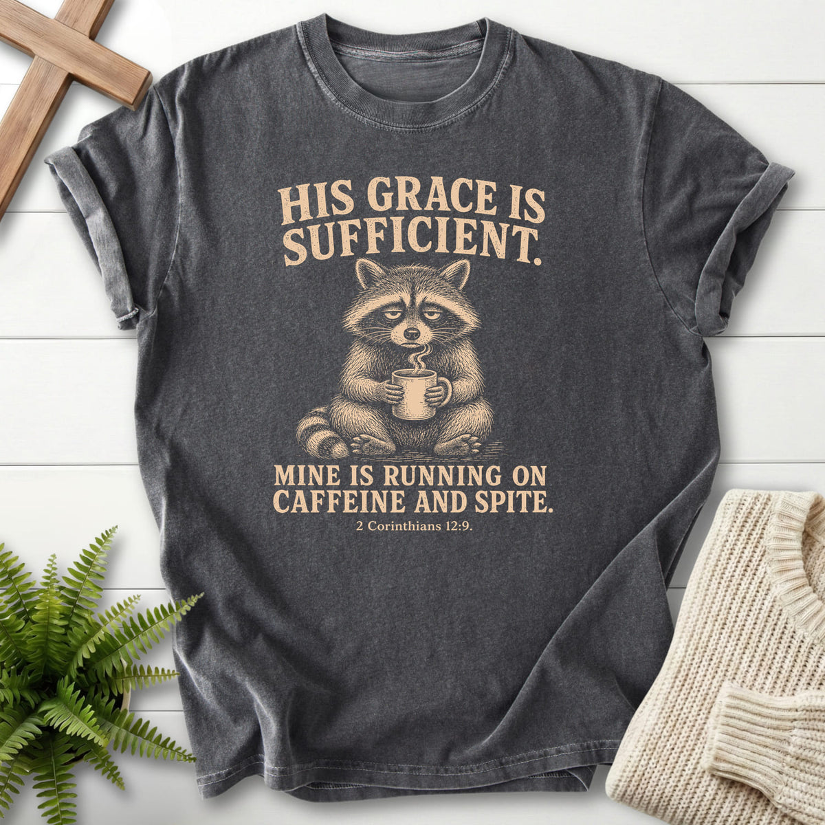 Pepper color option for the His Grace Is Sufficient Raccoon Scripture shirt with "His Grace Is Sufficient Raccoon T-Shirt" 2 Corinthians 12:9.