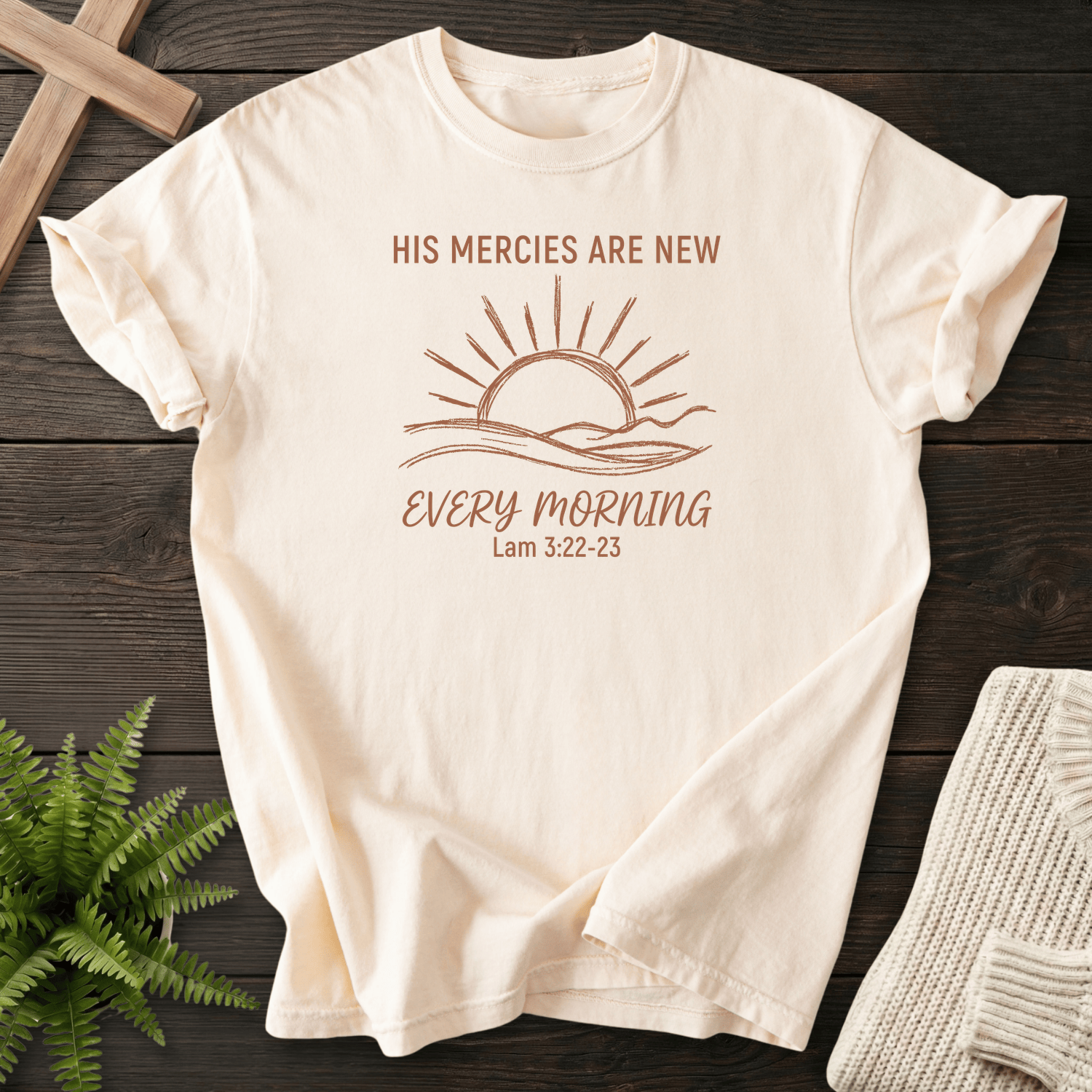 Ivory women's Christian t-shirt with minimalist sunrise line art and "His Mercies Are New Every Morning," inspired by Lamentations 3:22-23.