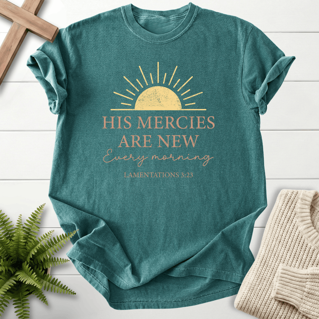 Blue Spruce women's Scripture shirt with a golden sunrise illustration, inspired by Lamentations 3:23.