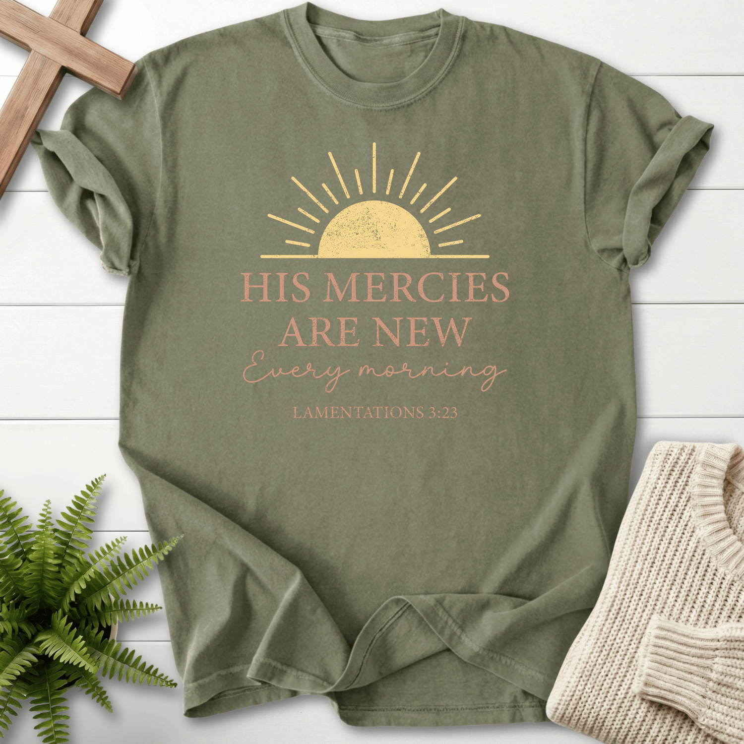 Sage women's Scripture shirt with a golden sunrise and vintage typography, inspired by Lamentations 3:23.