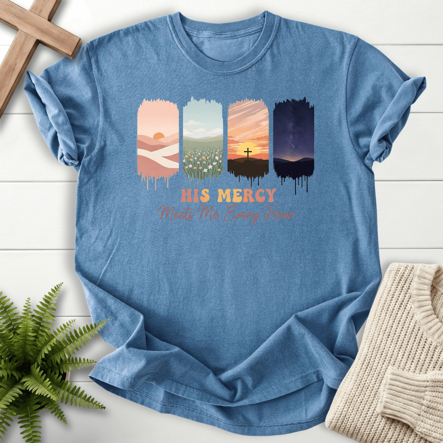 Blue Jean women's Christian t-shirt with painted four-panel nature scenes and "His Mercy Meets Me Every Hour" lettering