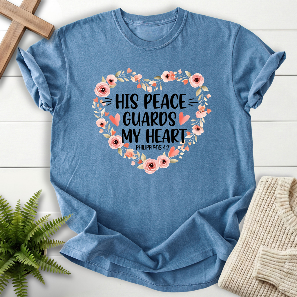 Blue Jean women's Christian t-shirt with "His Peace Guards My Heart" and a floral heart wreath, inspired by Philippians 4:7