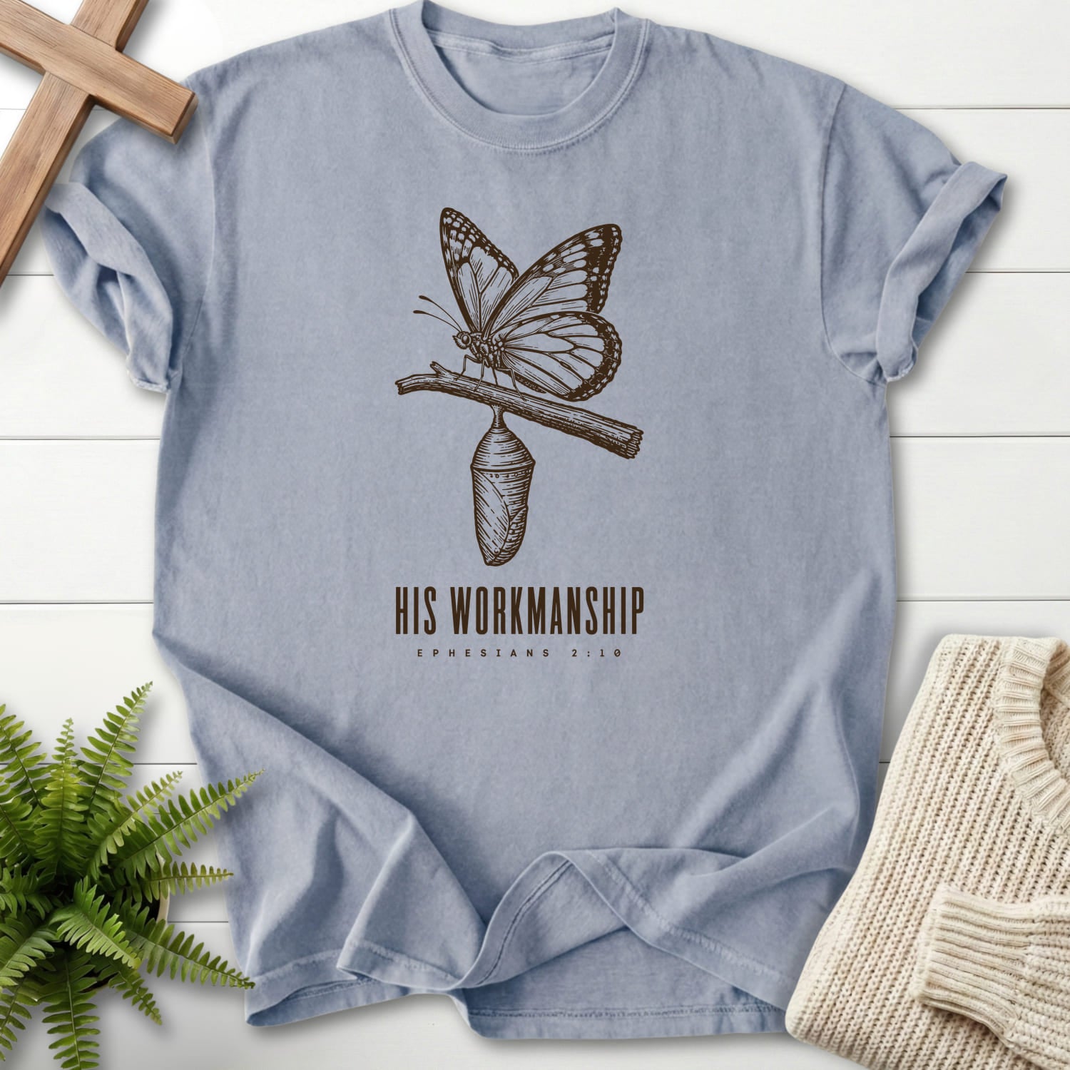 Flat lay of a Granite women's Christian tee featuring butterfly artwork with "His Workmanship T-Shirt".
