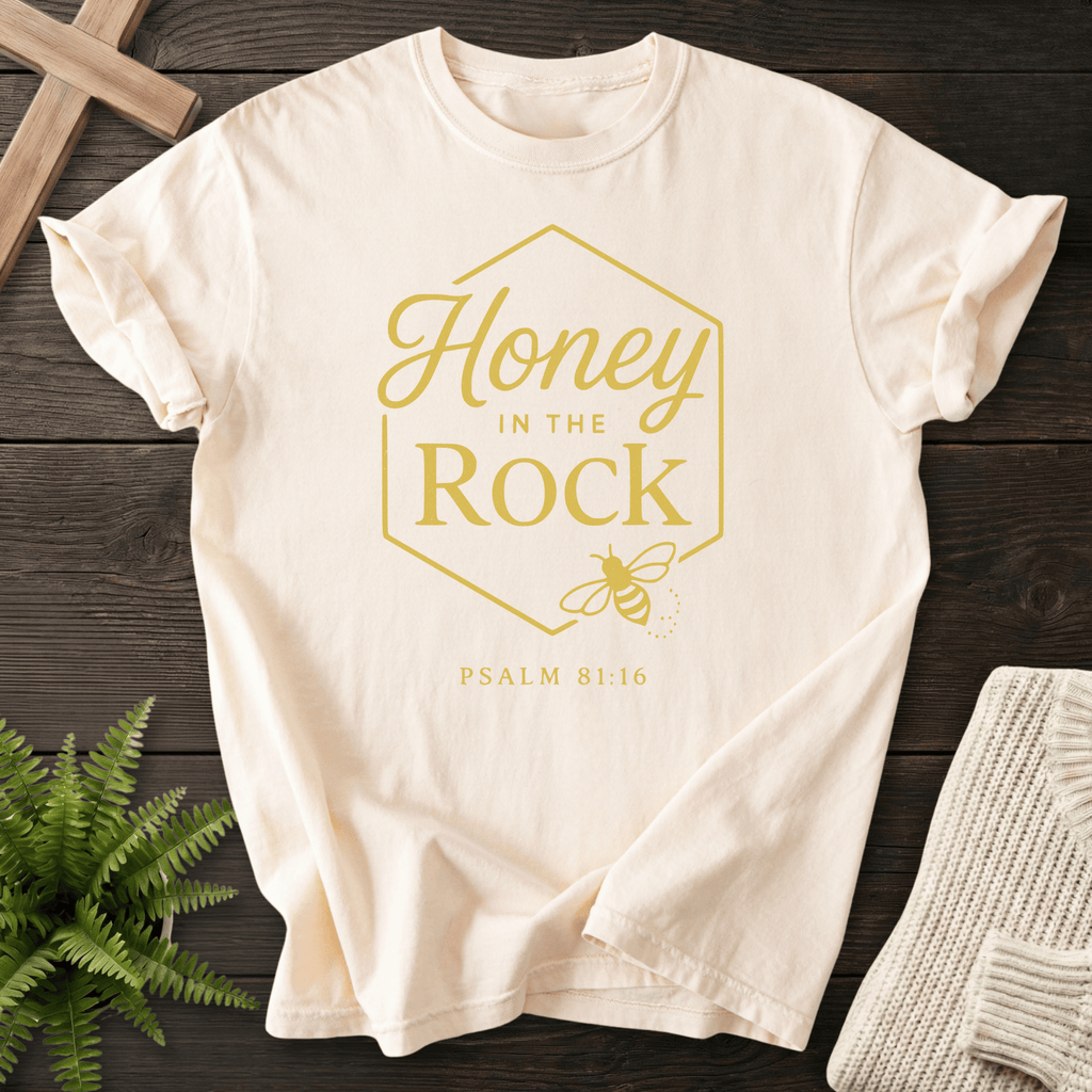 Ivory women's Christian t-shirt with a honeycomb hexagon, bee illustration, and Psalm 81:16 in gold lettering, inspired by Psalm 81:16.