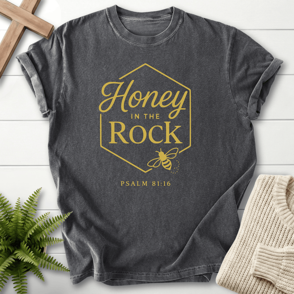Pepper women's Christian t-shirt with a gold hexagon honeybee frame and "Honey in the Rock," inspired by Psalm 81:16.