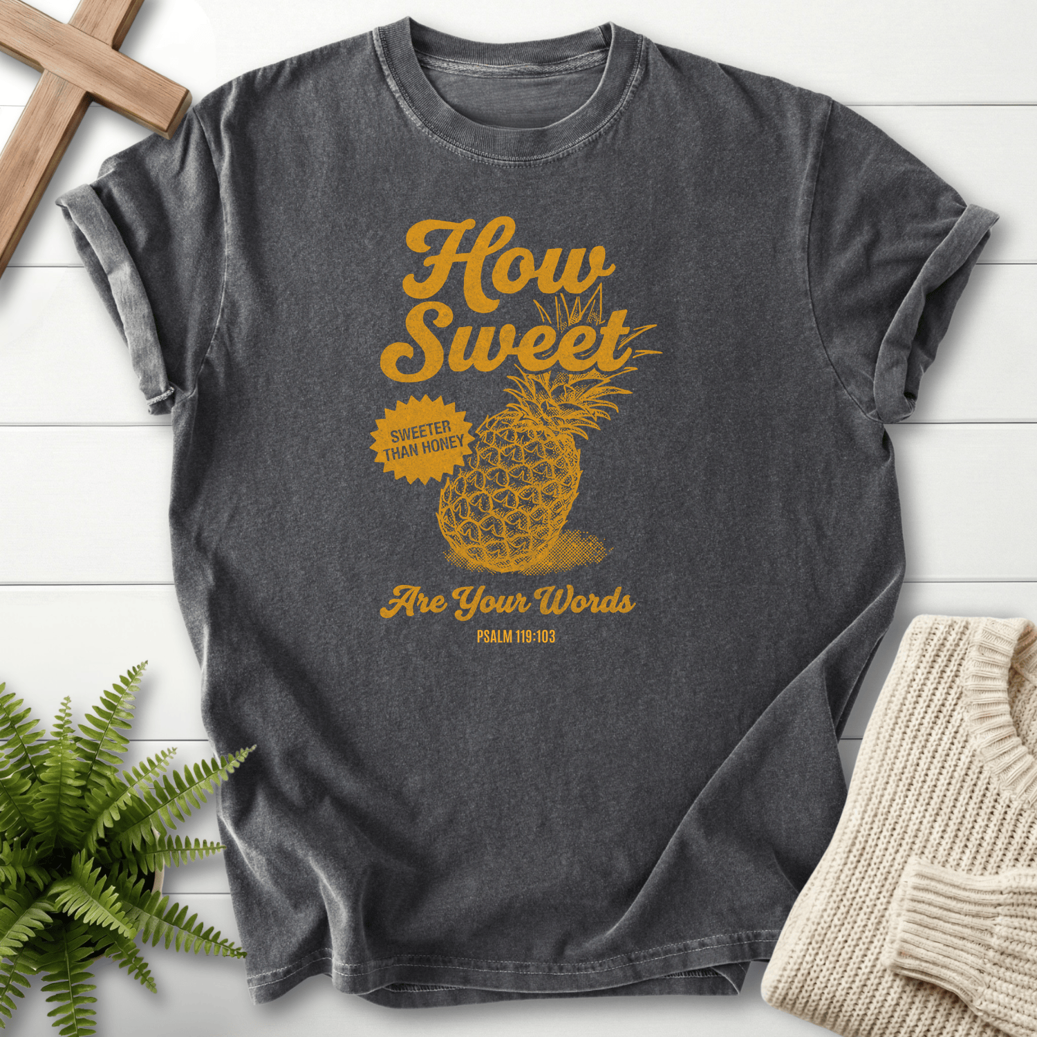 Pepper women's Christian t-shirt with a golden pineapple illustration, inspired by Psalm 119:103.