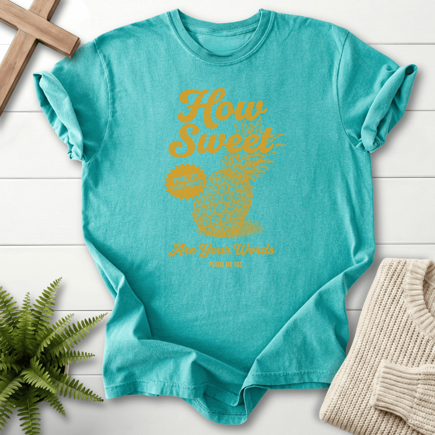 Seafoam women's Christian t-shirt with a vintage pineapple motif and gold lettering, inspired by Psalm 119:103.