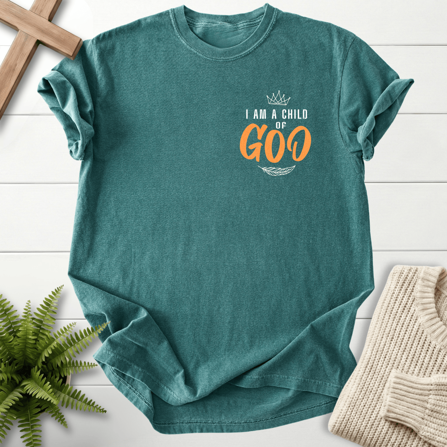 Blue Spruce women's Christian t-shirt with subtle pocket placement and a crown illustration