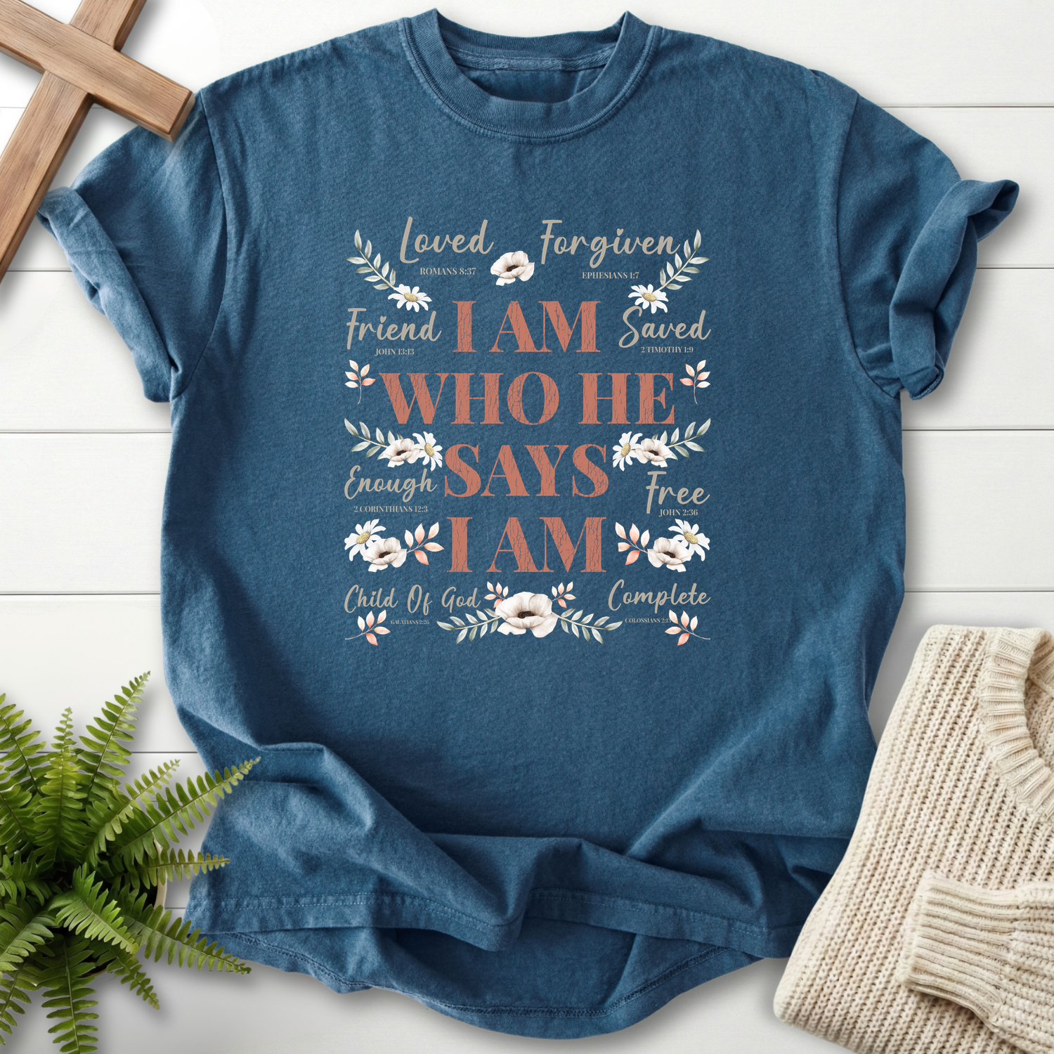 Midnight women's Christian t-shirt with "I Am Who He Says I Am" identity typography and cotton flower accents