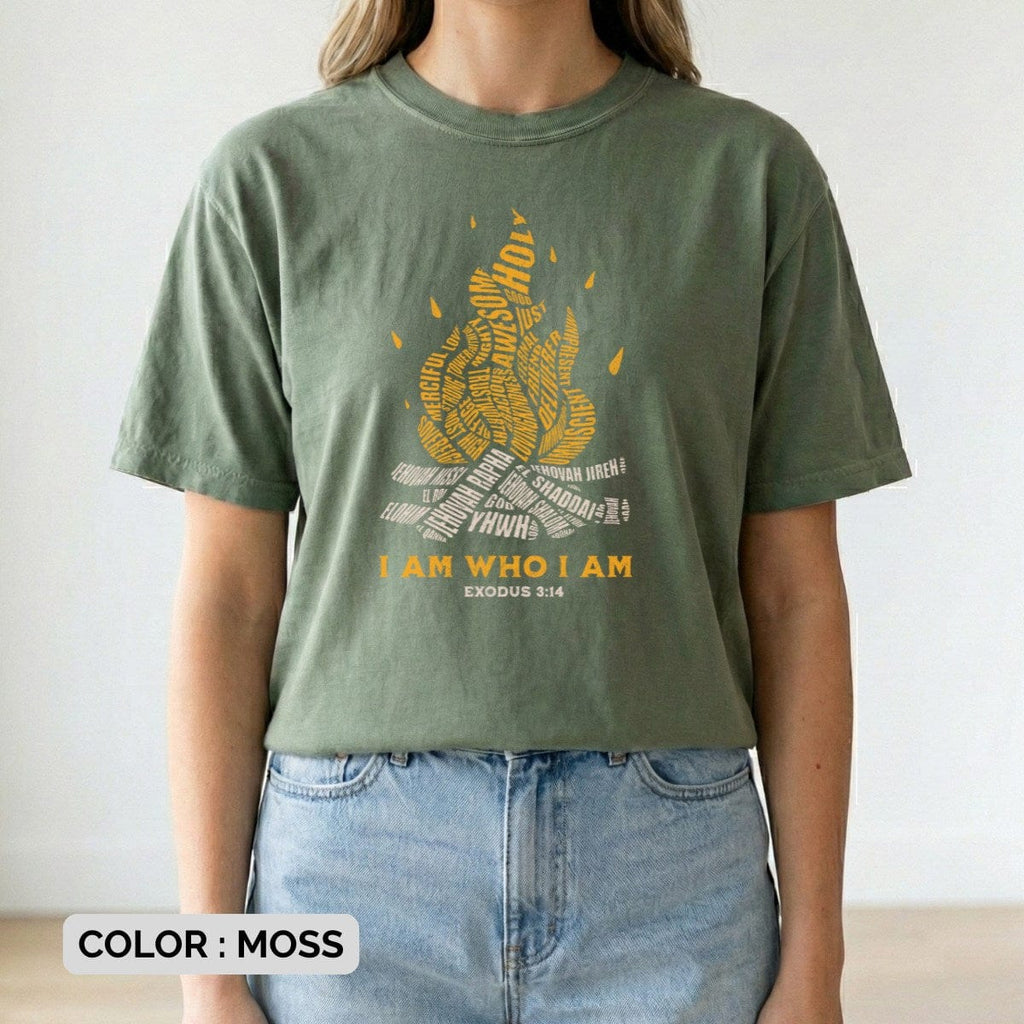 Christian women tee featuring “I Am Who I Am” Exodus 3:14 flame typography design worn as a lifestyle fit on a Comfort Colors 1717 tshirt in Moss green. Faith-based Christian tshirt with soft garment-dyed fabric, casual everyday US faith wear style
