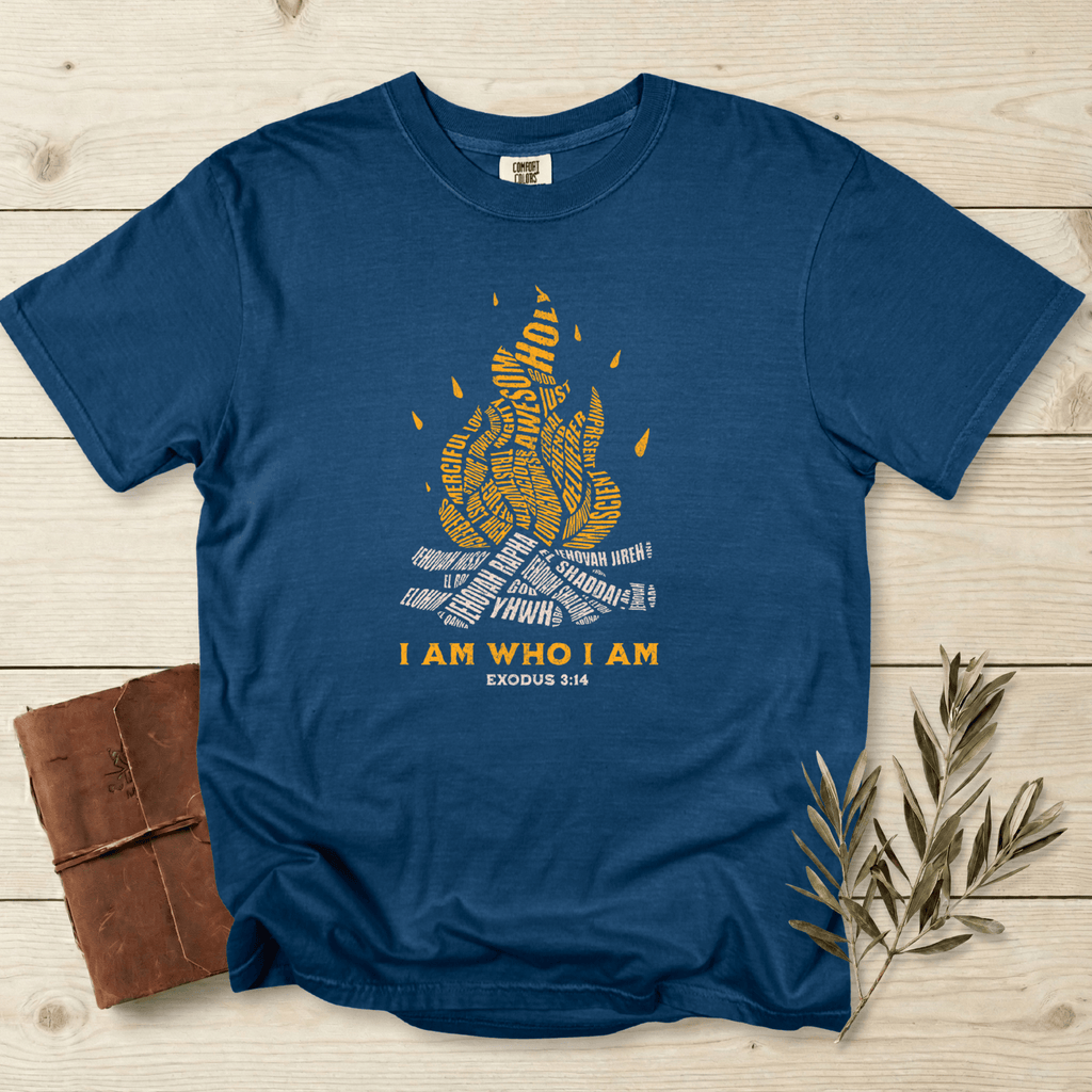 I Am Who I Am” Exodus 3:14 Christian women tshirt on Comfort Colors 1717 in Midnight blue. Scripture-inspired faith wear tee with flame-shaped typography design, soft garment-dyed fabric, perfect for casual US Christian apparel.