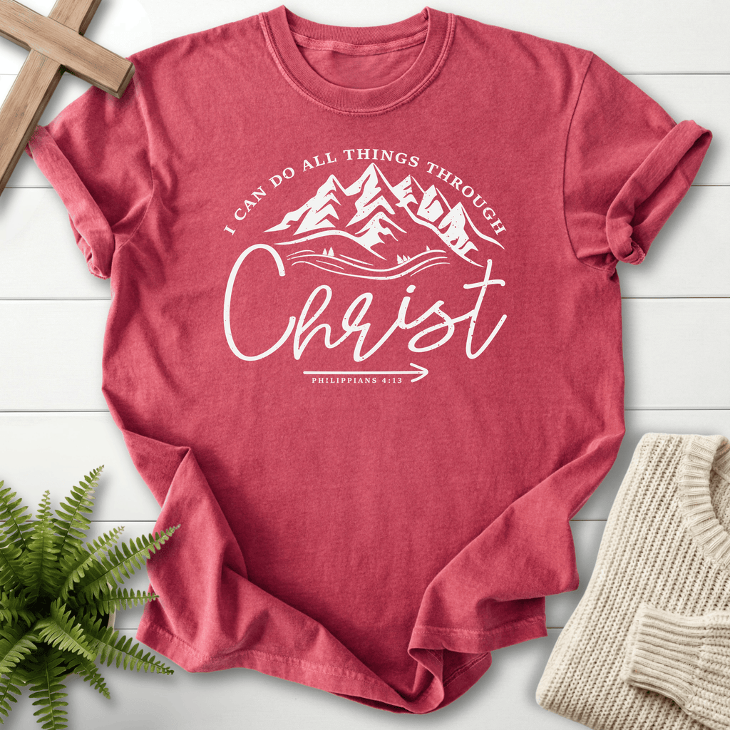 Crimson women's Christian t-shirt with mountain and forest circle art and "I Can Do All Things Through Christ," inspired by Philippians 4:13