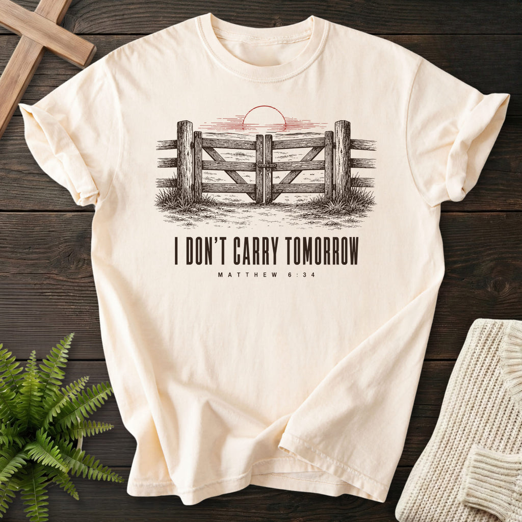 Flat lay of an Ivory Comfort Colors 1717 Christian t-shirt for women featuring "I Don't Carry Tomorrow T-Shirt" Matthew 6:34.
