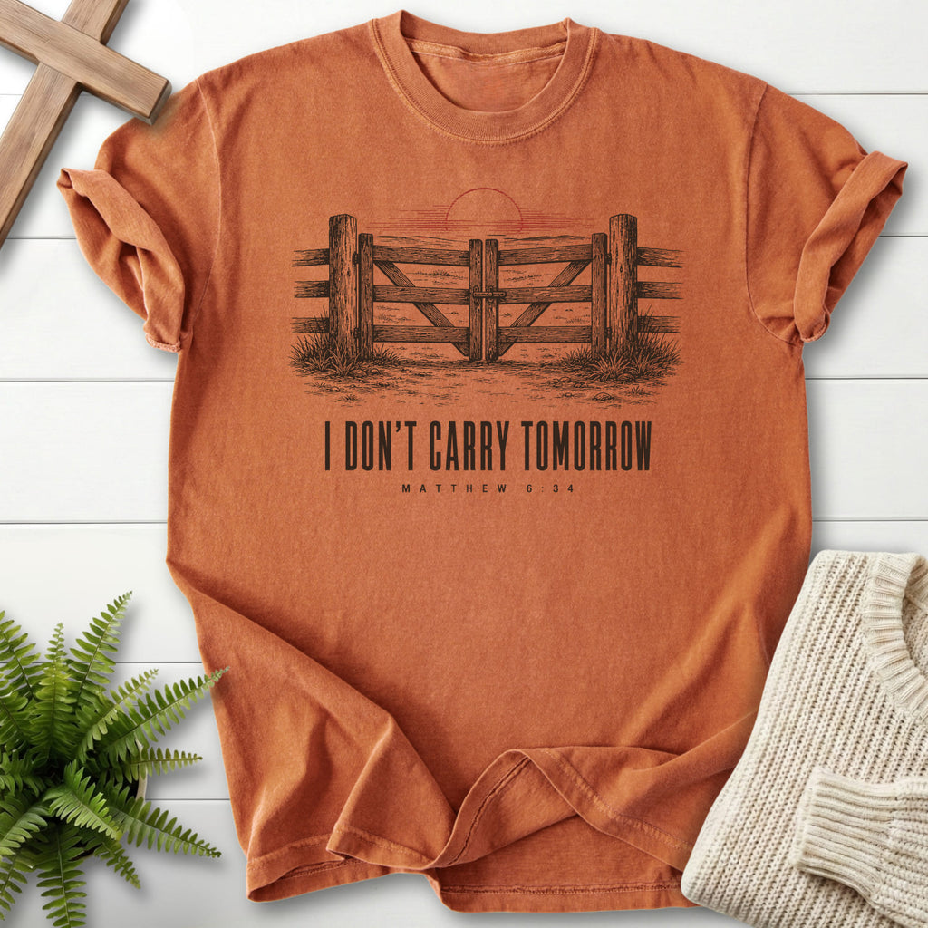 Flat lay of a Yam Bible verse tee featuring "I Don't Carry Tomorrow T-Shirt" Matthew 6:34.