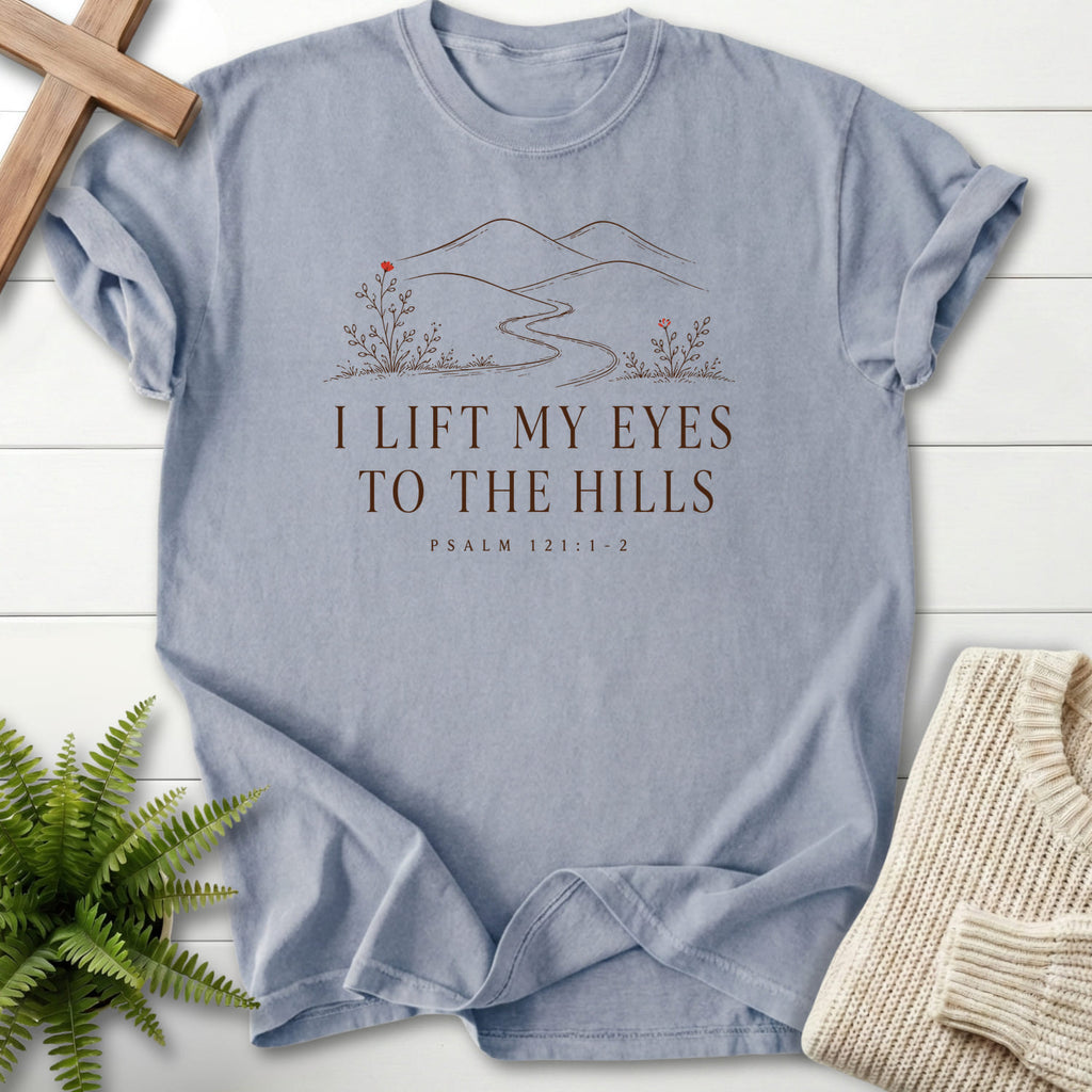 Flat lay of a Granite Christian shirt featuring floral line art with "I Lift My Eyes to the Hills T-Shirt" Psalm 121:1-2.