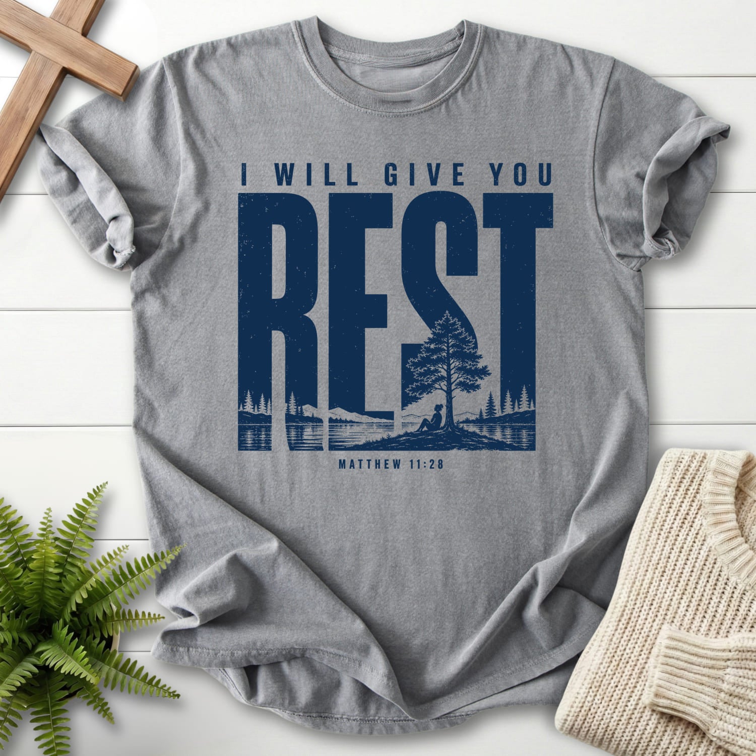 Flat lay of a Grey Scripture shirt featuring "I Will Give You Rest T-Shirt" Matthew 11:28.