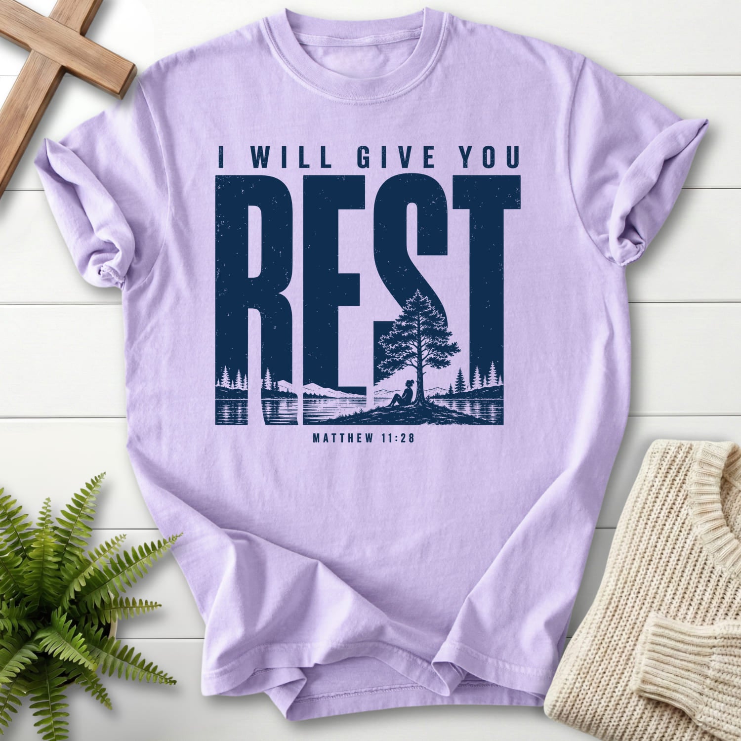 Flat lay of an Orchid Comfort Colors 1717 garment-dyed Christian tee featuring "I Will Give You Rest T-Shirt" Matthew 11:28 From Printify.