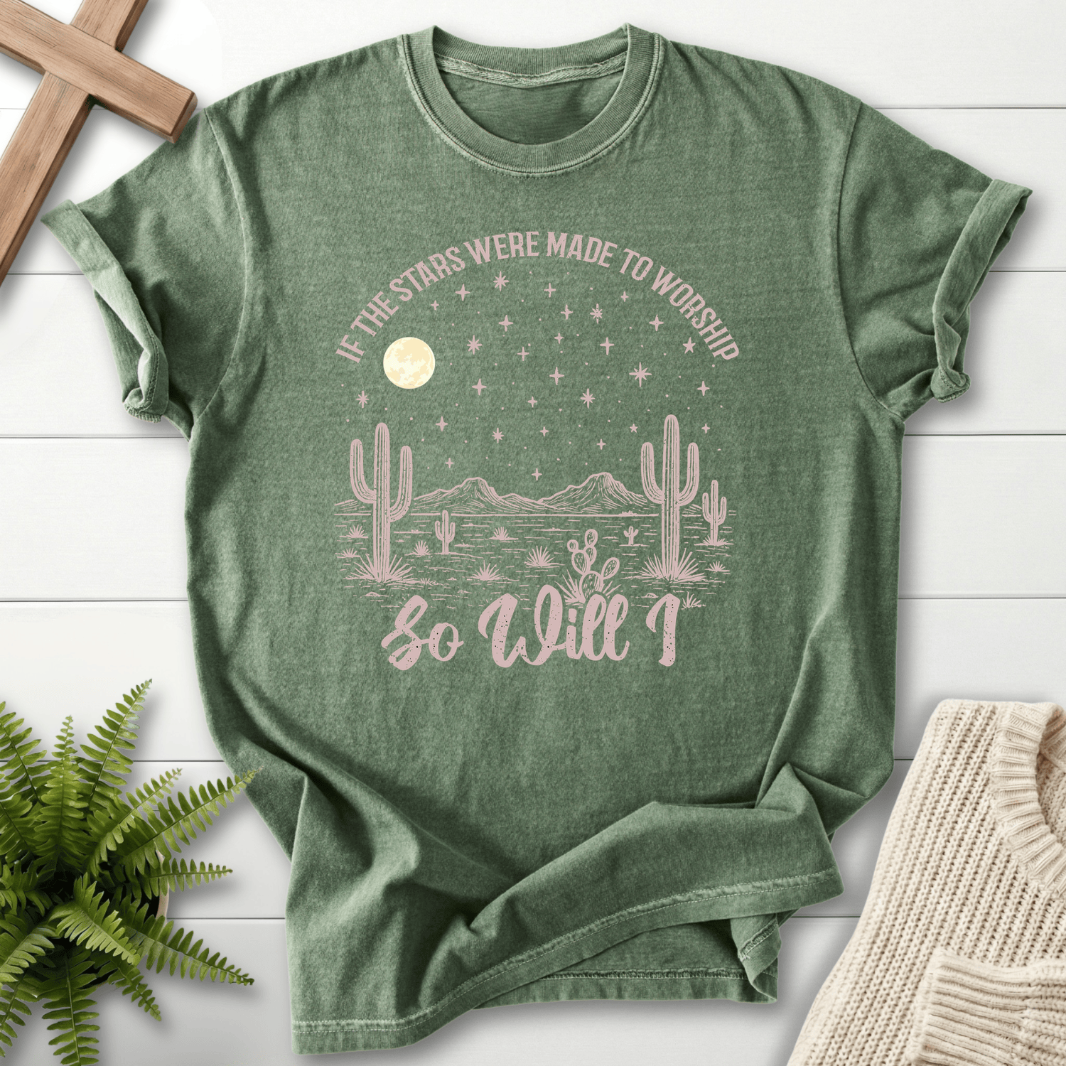Moss women's Christian t-shirt with a western starry night desert scene and arched worship lettering, She Wears Faith