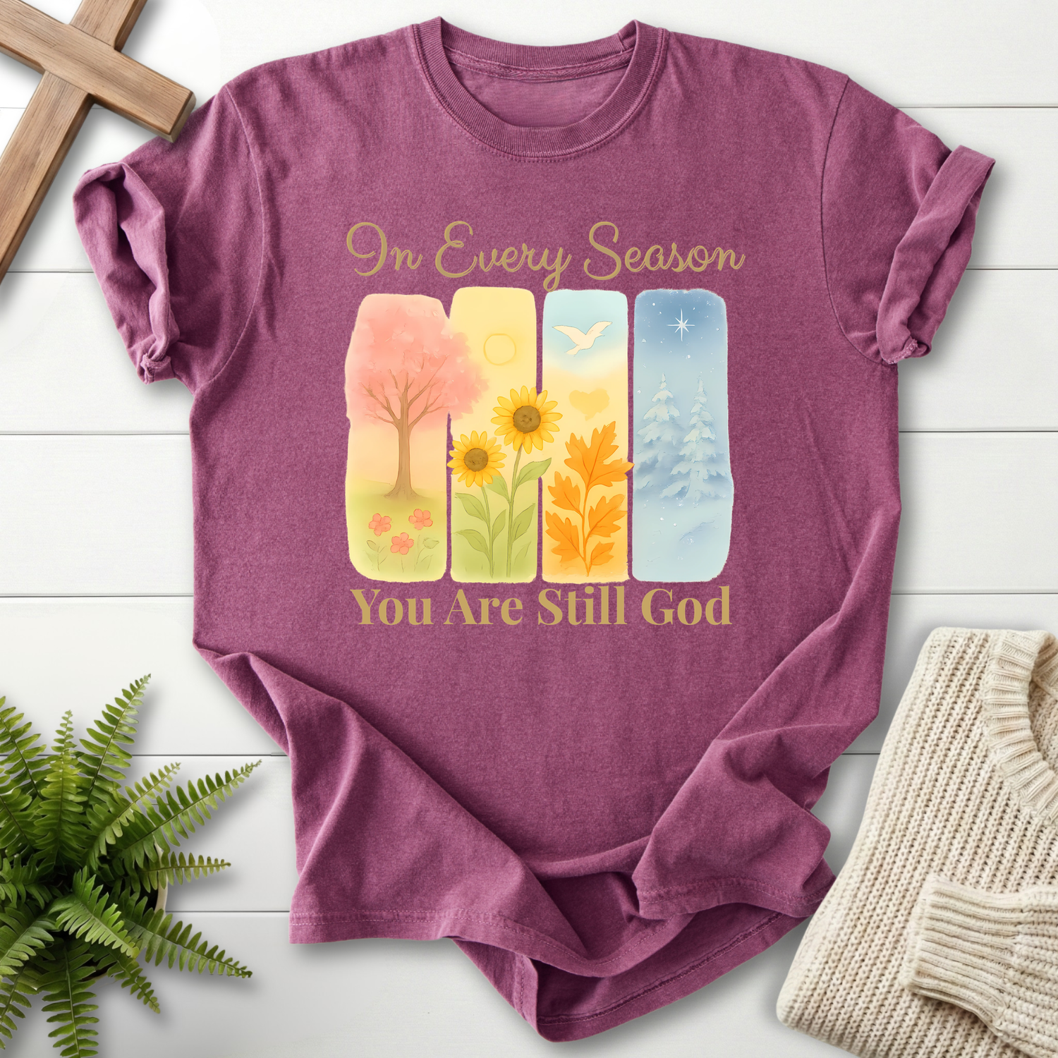 Berry women's Christian t-shirt with a four-season watercolor panel design and soft floral accents.