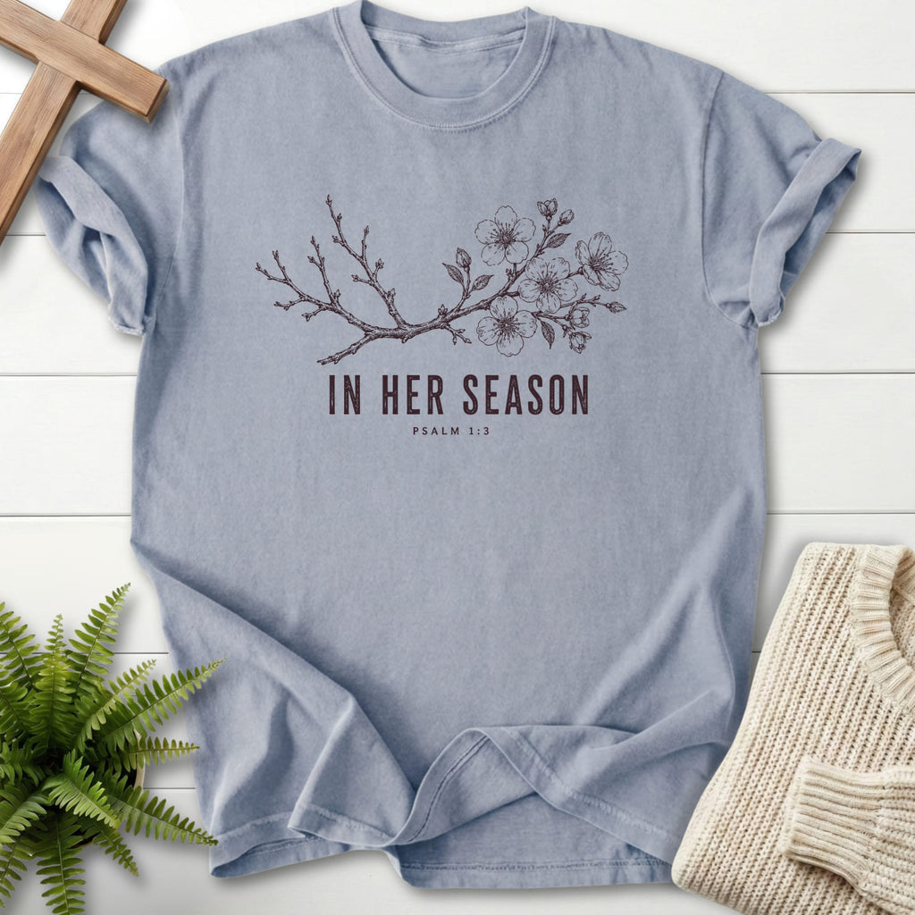 Flat lay of a Granite Christian t-shirt for women featuring flowering branch artwork with "In Her Season T-Shirt" Psalm 1:3.