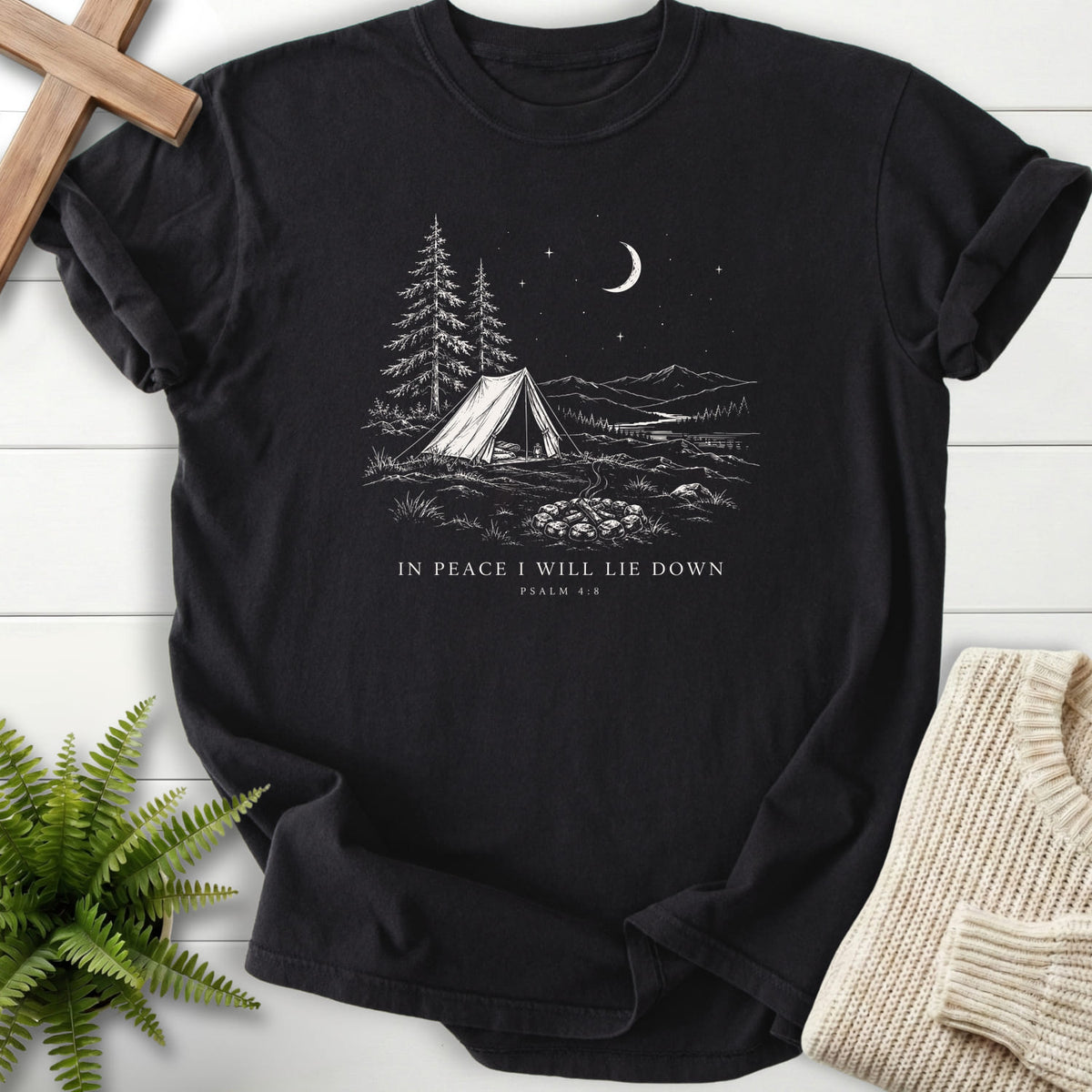 Flat lay of a Black Christian shirt featuring "In Peace I Will Lie Down T-Shirt" This Psalm 4:8.