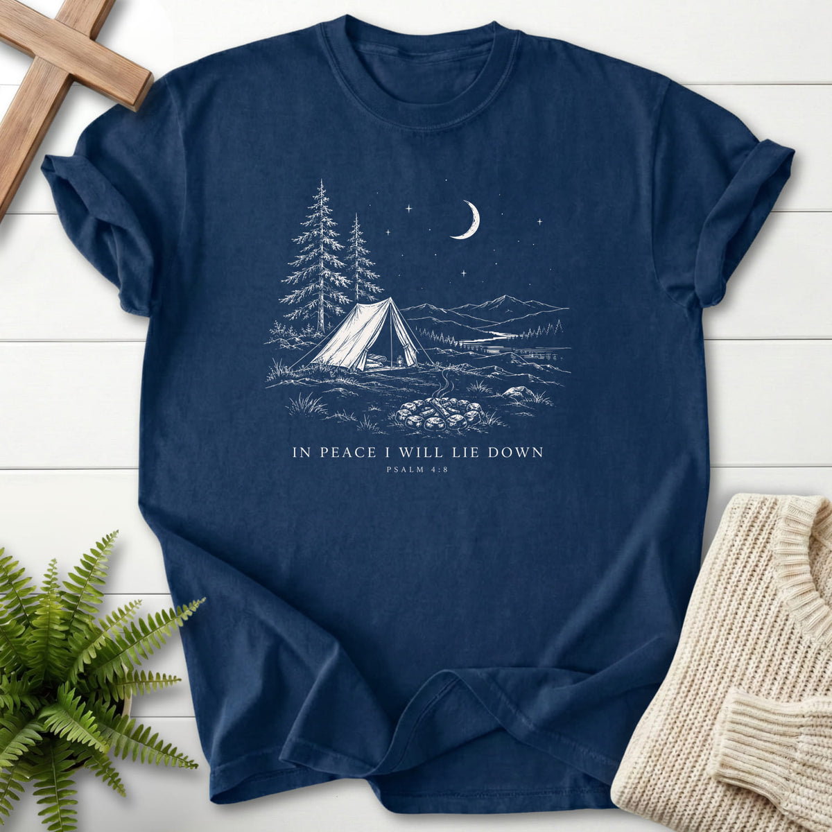 Flat lay of a Navy Scripture shirt featuring "In Peace I Will Lie Down T-Shirt" This Psalm 4:8.