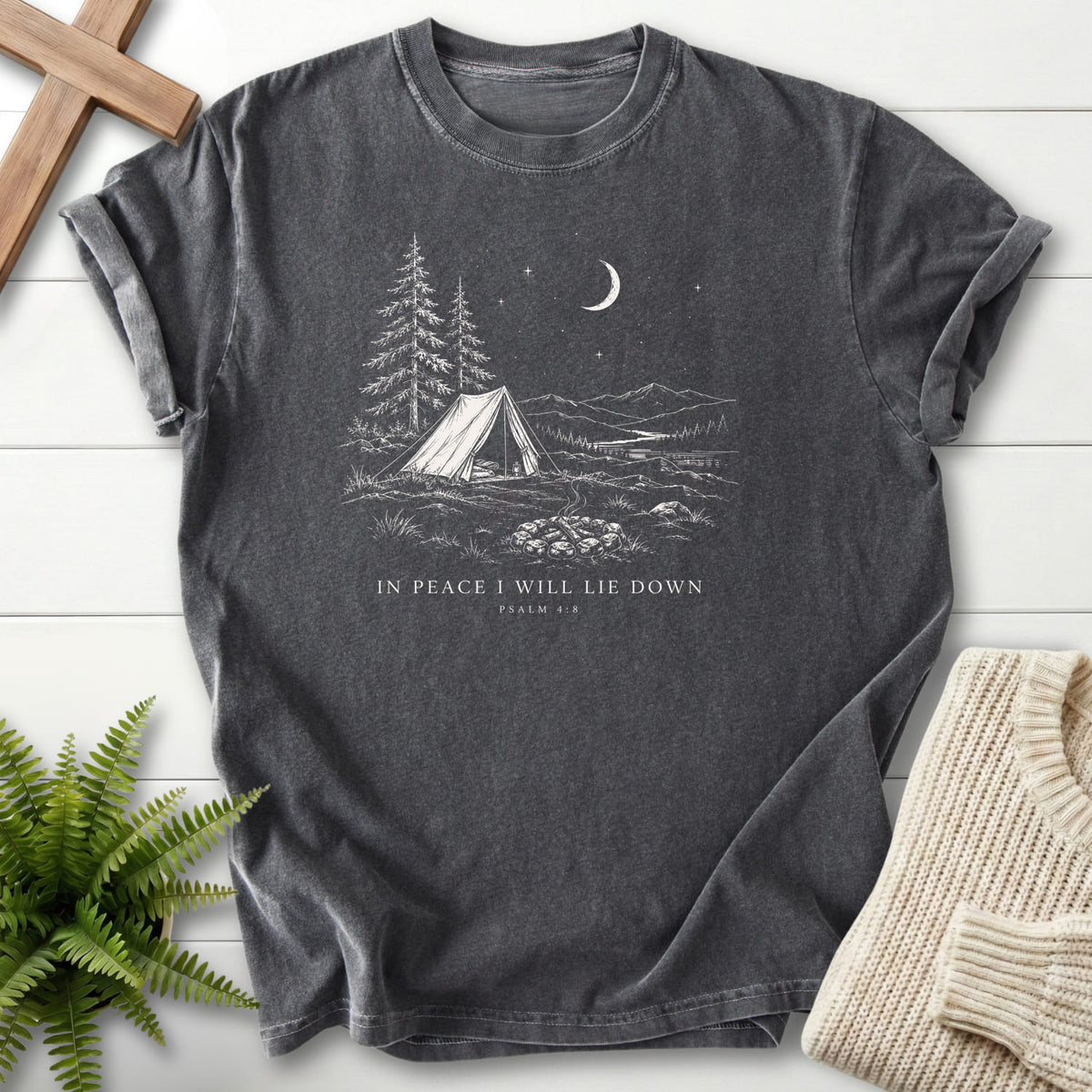 Flatlay of a Pepper Bible verse tee with "In Peace I Will Lie Down T-Shirt" This Psalm 4:8.