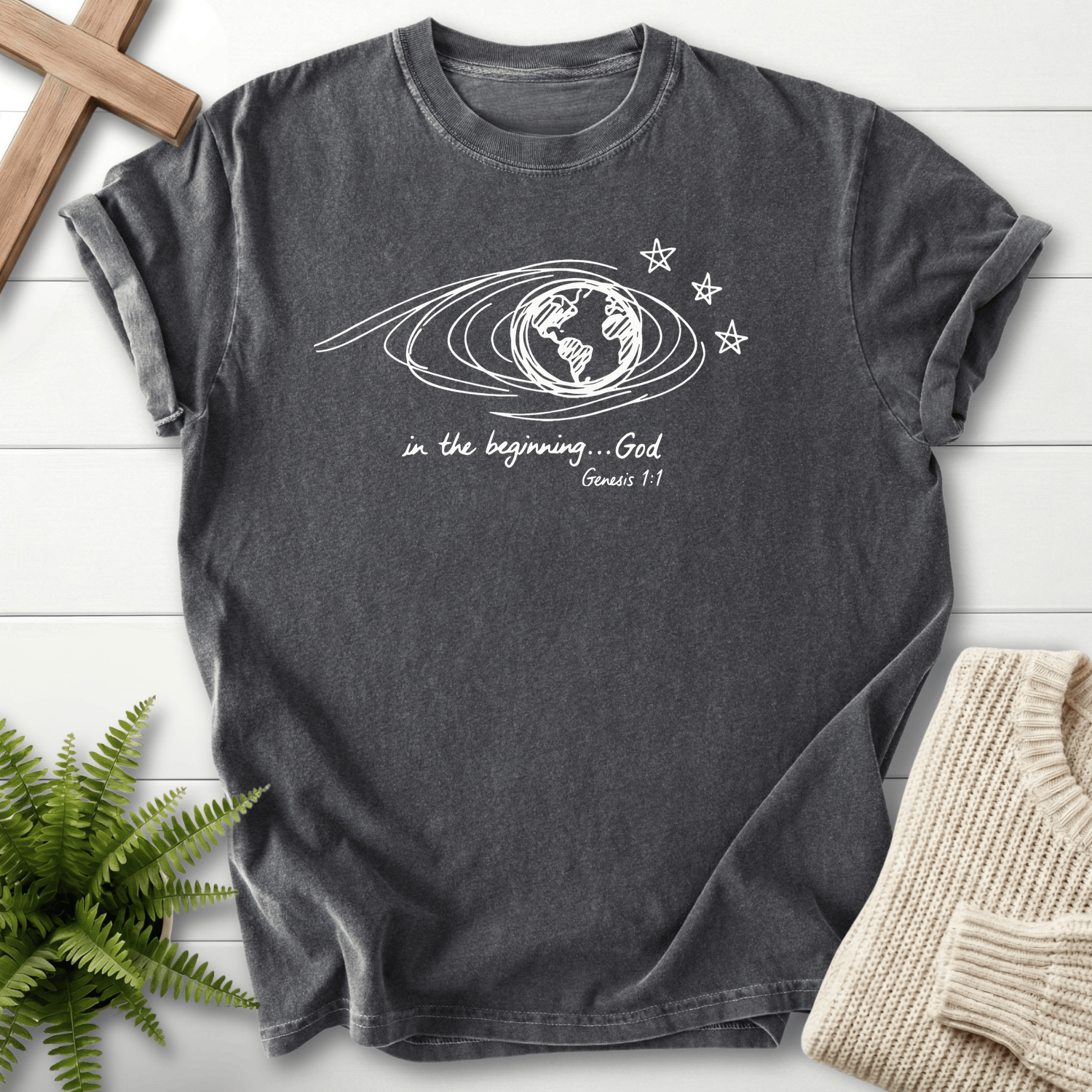 Pepper women's Christian t-shirt with line-art Earth and an orbital swirl, inspired by Genesis 1:1