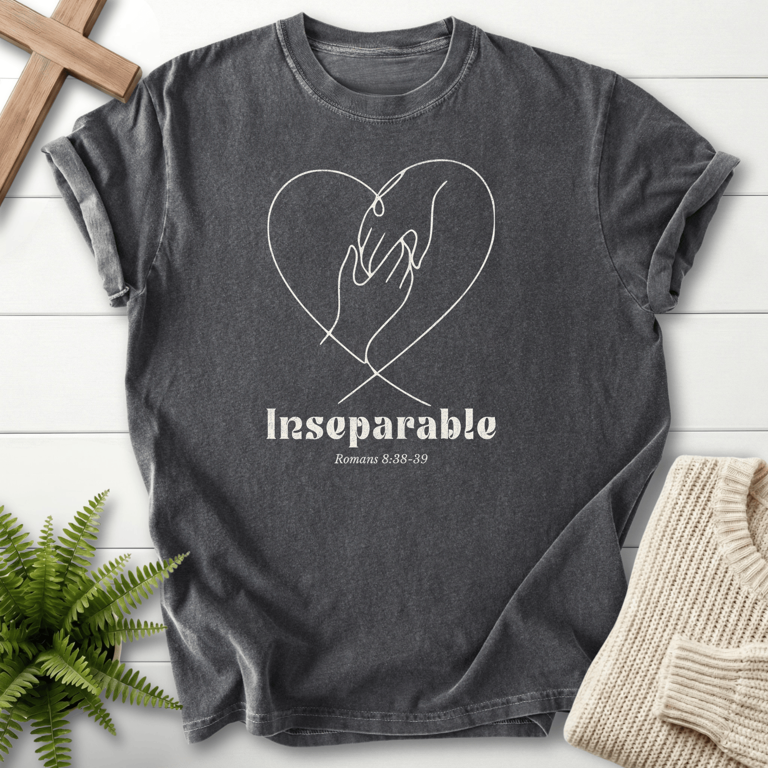 Pepper Christian t-shirt for women with two hands clasped inside a line-art heart, inspired by Romans 8:38-39.