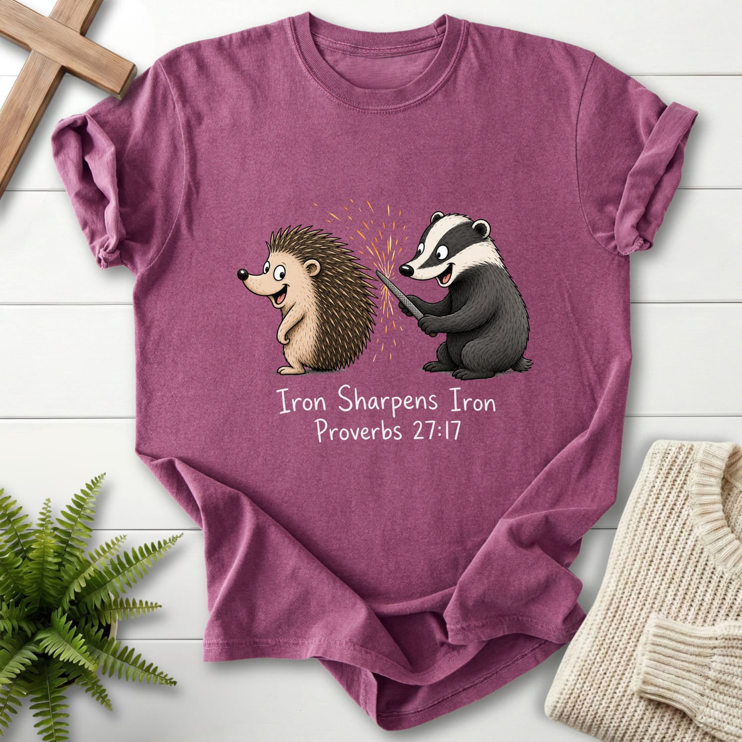 Flat lay of a Berry Christian shirt featuring "Iron Sharpens Iron Proverbs 27:17 T-Shirt" Proverbs 27:17.