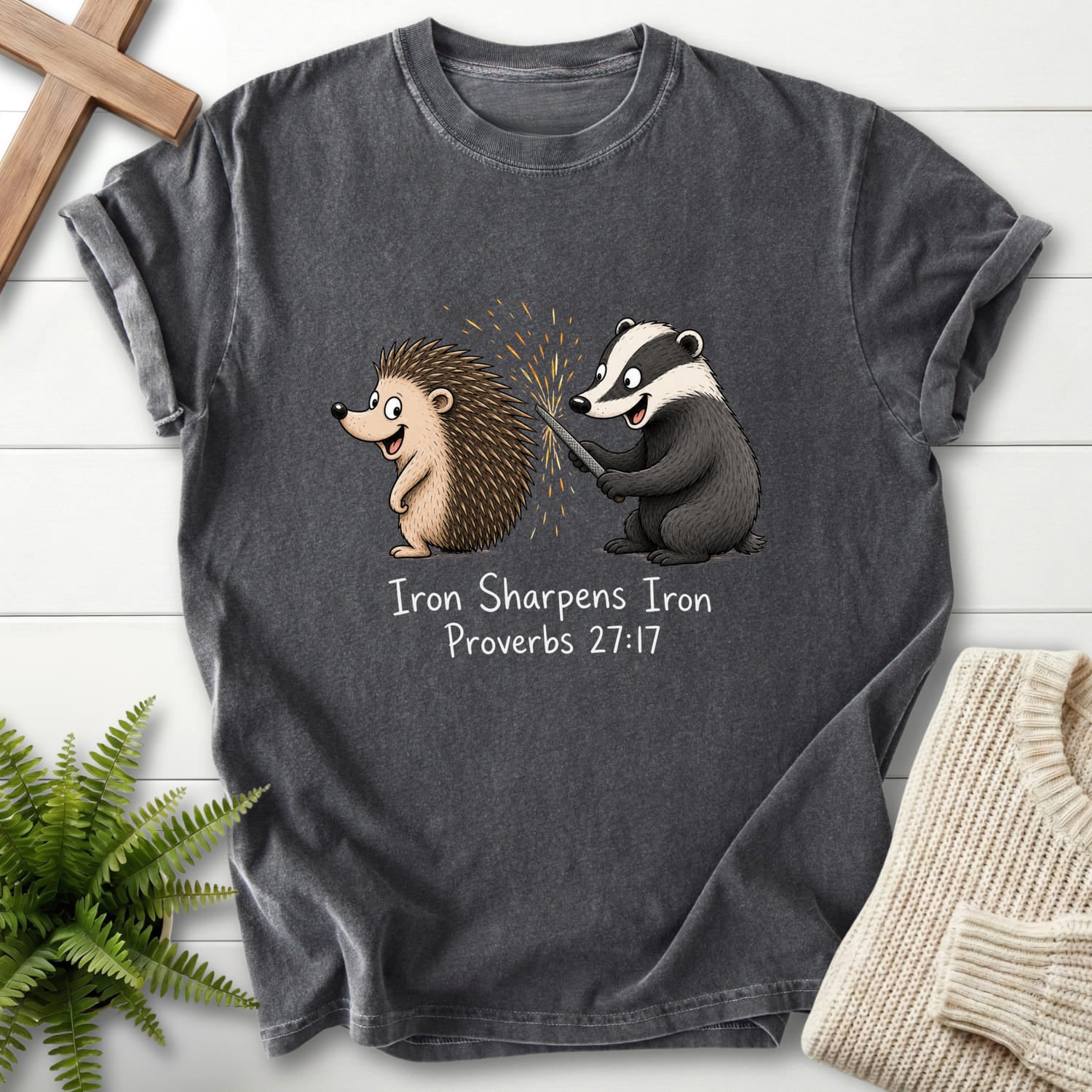Flat lay of a Pepper Comfort Colors 1717 garment-dyed Christian tee featuring "Iron Sharpens Iron Proverbs 27:17 T-Shirt" Proverbs 27:17.