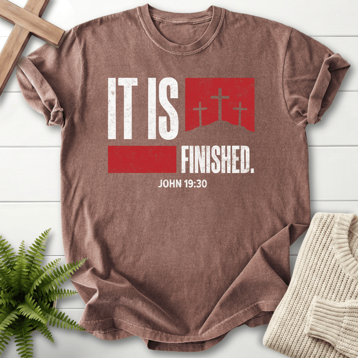 Espresso women's Christian t-shirt with white grunge "It Is Finished" text and a red cross banner, inspired by John 19:30