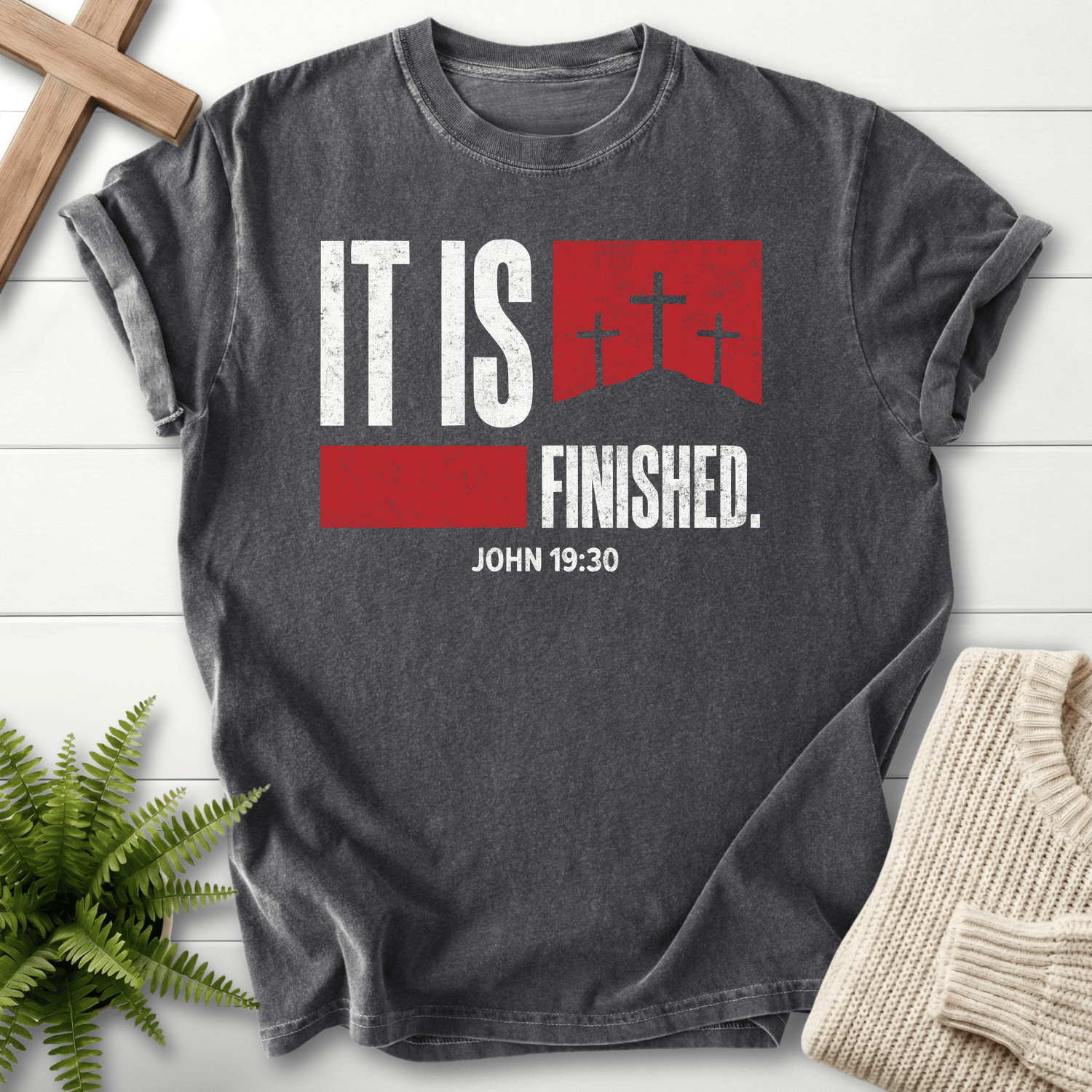 Pepper women's Christian t-shirt with white "It Is Finished" lettering and a red cross graphic, inspired by John 19:30