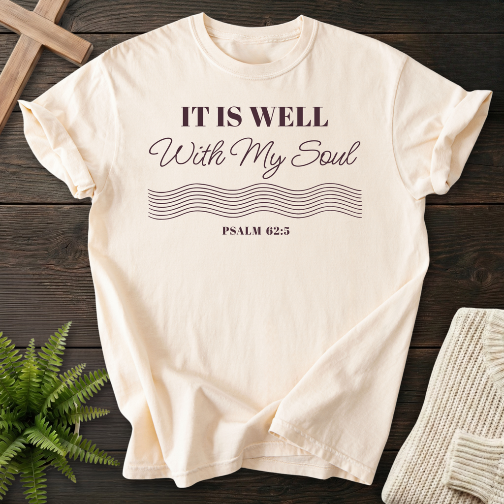 Ivory women's Christian t-shirt with elegant "It Is Well With My Soul" lettering and flowing lines, inspired by Psalm 62:5
