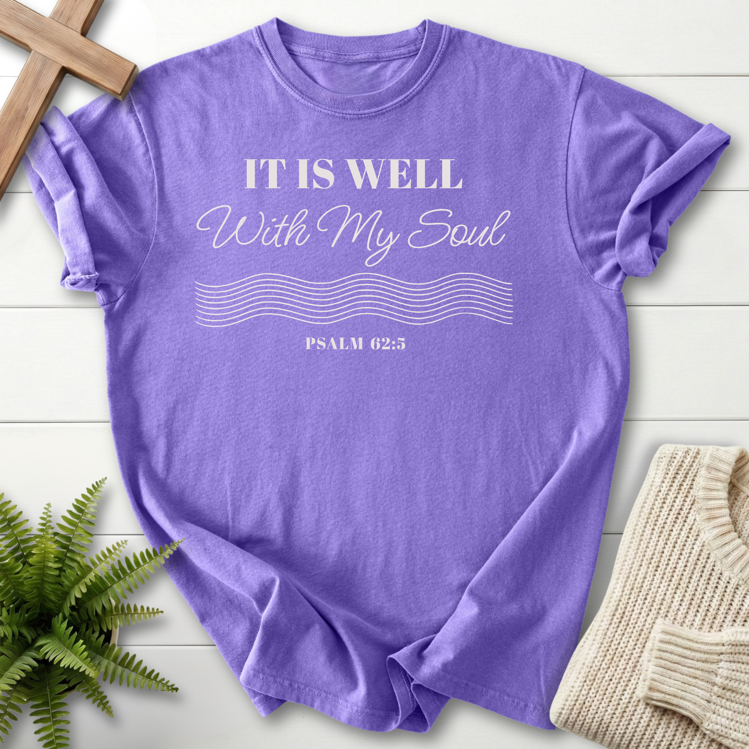 Violet women's Christian t-shirt with white "It Is Well With My Soul" text and wave lines, inspired by Psalm 62:5