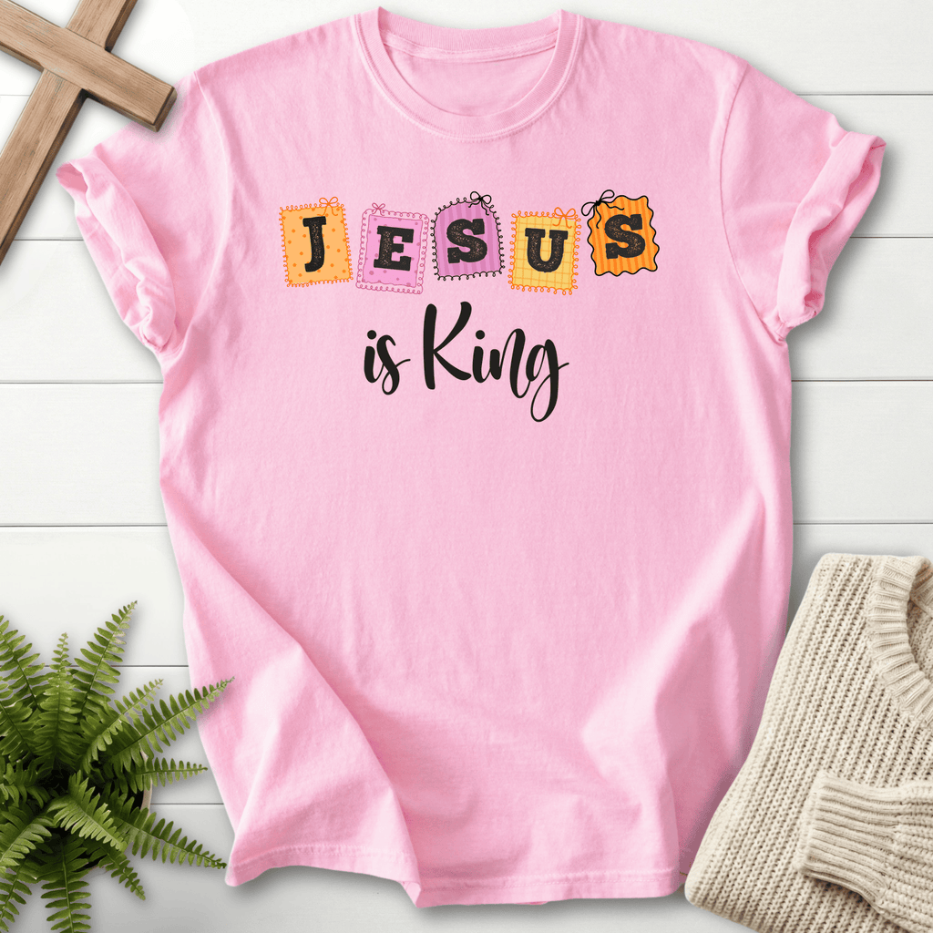 Blossom women's Christian t-shirt with fun patchwork "JESUS is King" stamp-style lettering