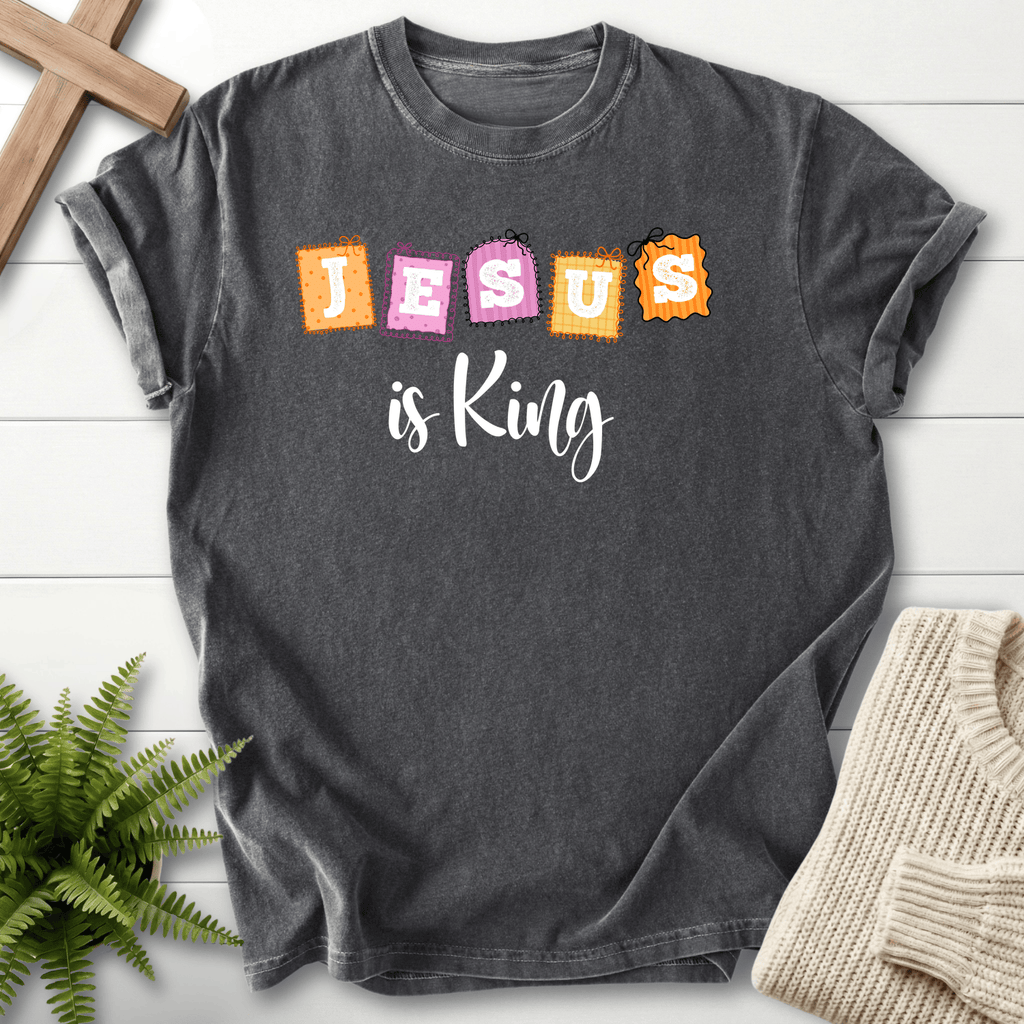 Pepper women's Christian t-shirt with a colorful "JESUS is King" patchwork stamp design