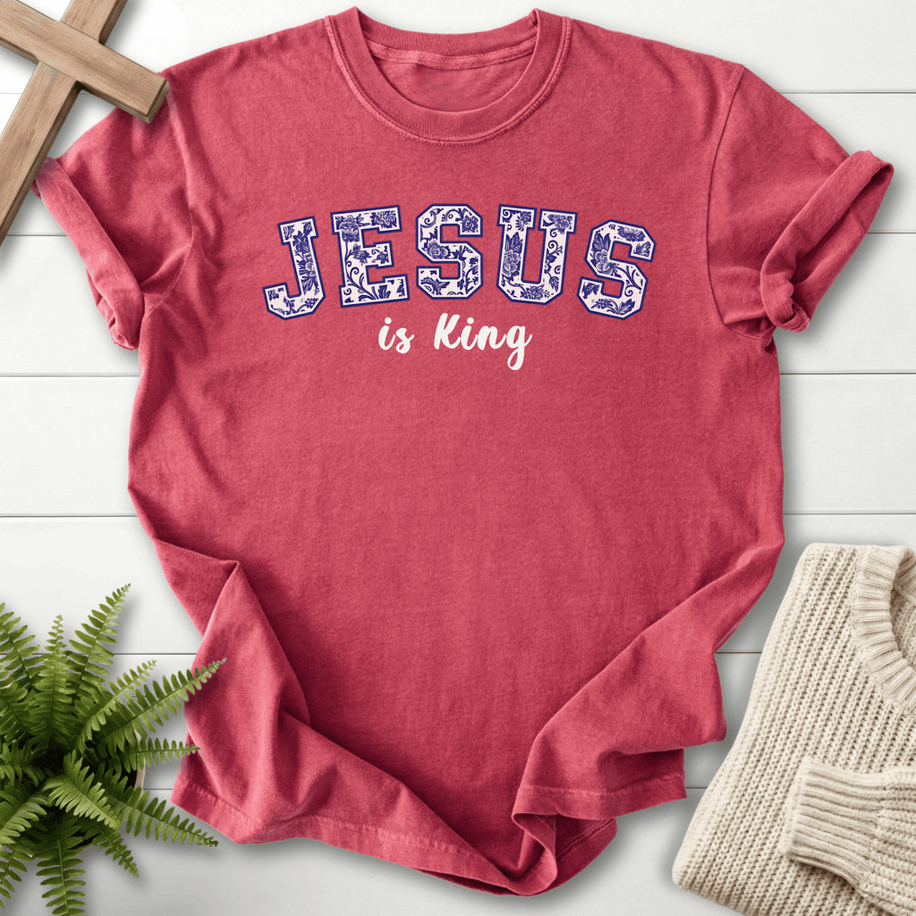 Crimson women's Christian t-shirt with a floral-filled varsity "JESUS is King" graphic