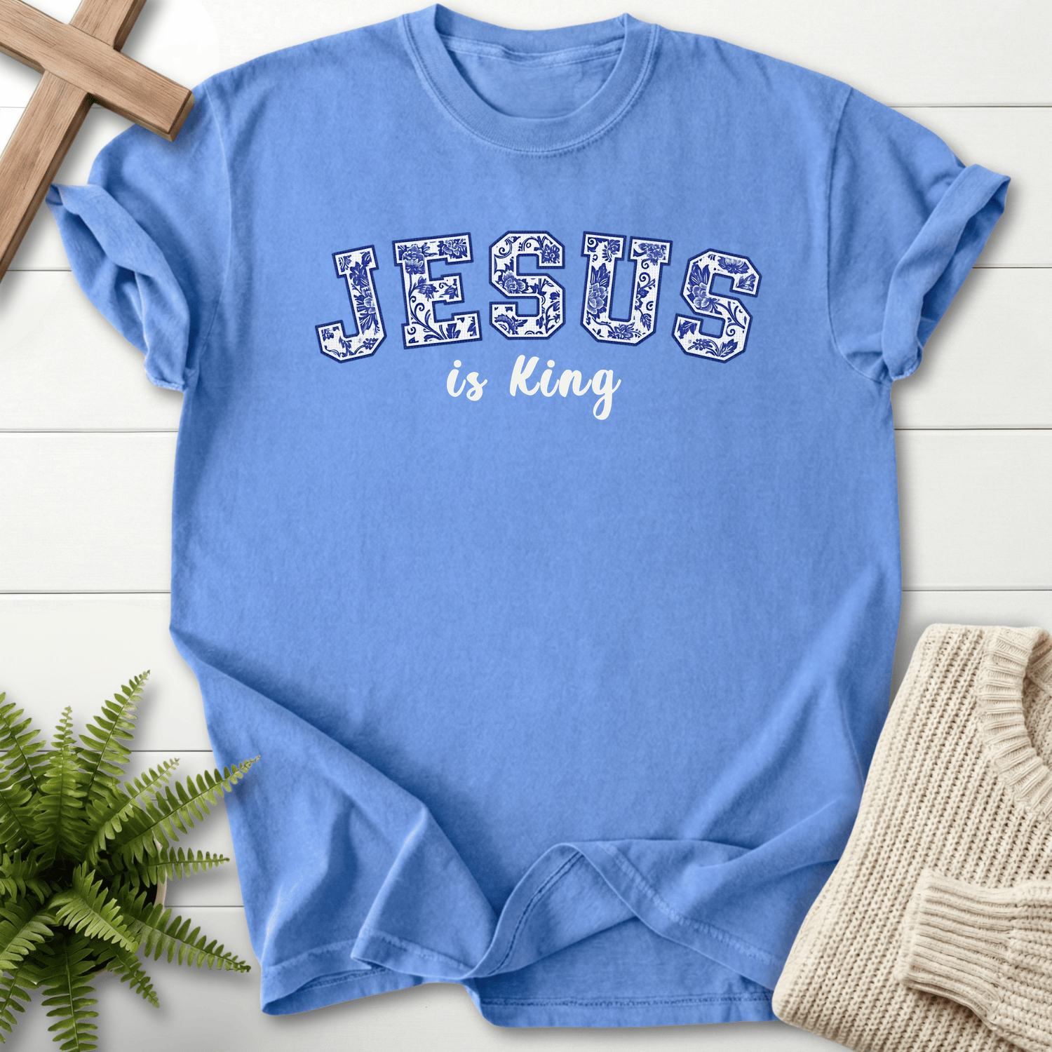Mystic Blue women's Christian t-shirt with a floral varsity "JESUS is King" print