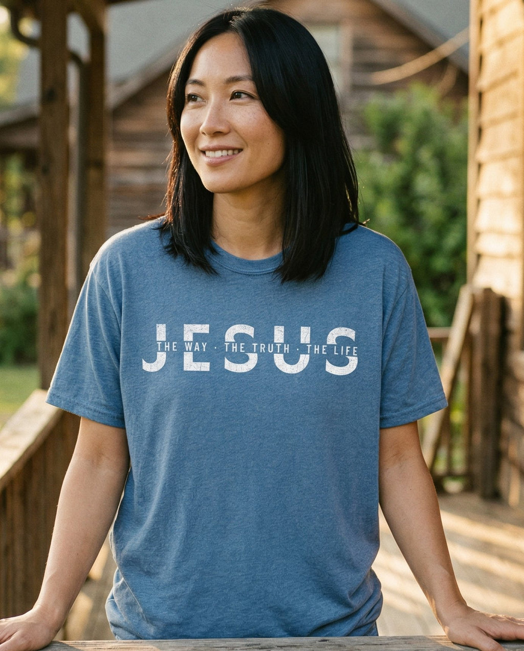 Jesus Way Truth Life – Blue Jean women's Christian tee, lifestyle photo in sunny porch – Distressed grunge typography with 'The Way – She Wears Faith