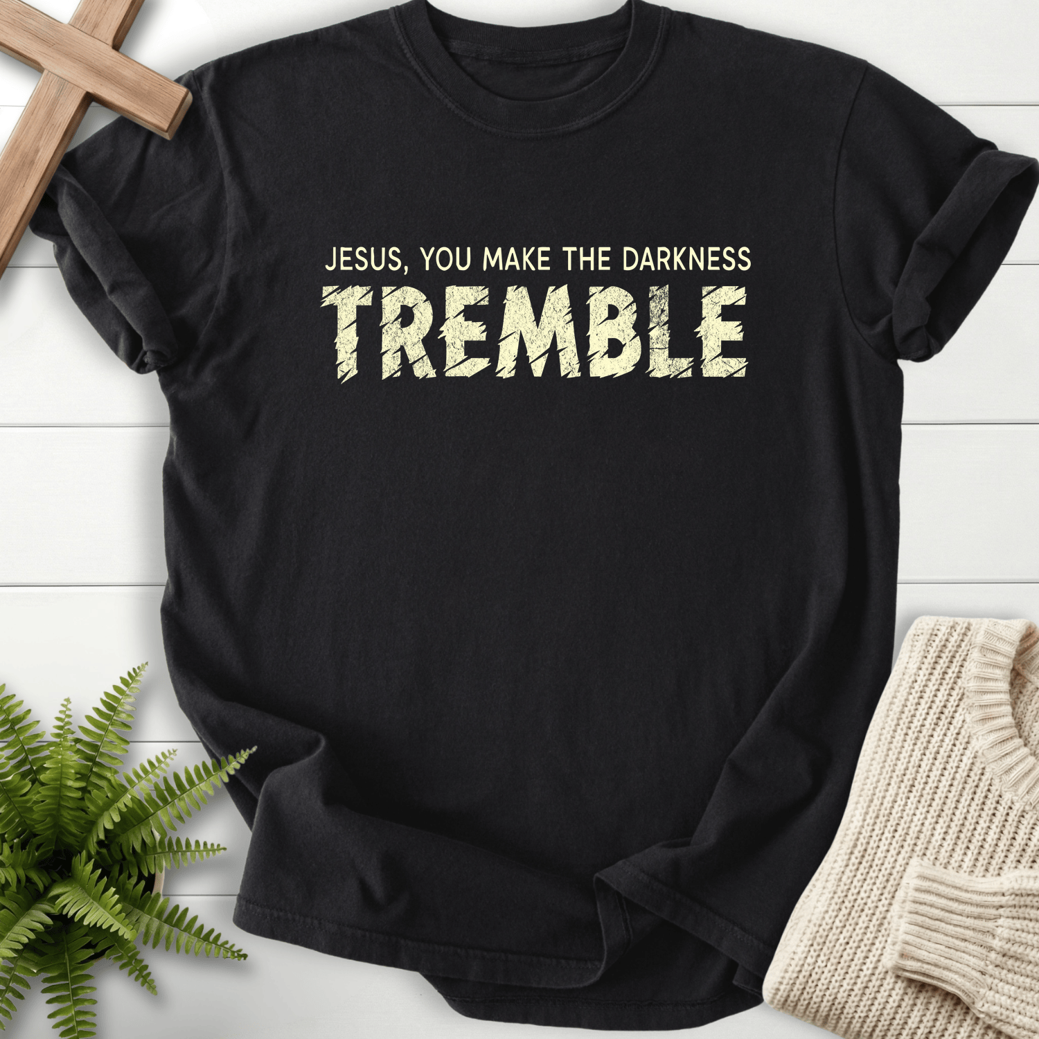 Black women's Christian t-shirt with white grunge "Jesus You Make the Darkness Tremble" typography
