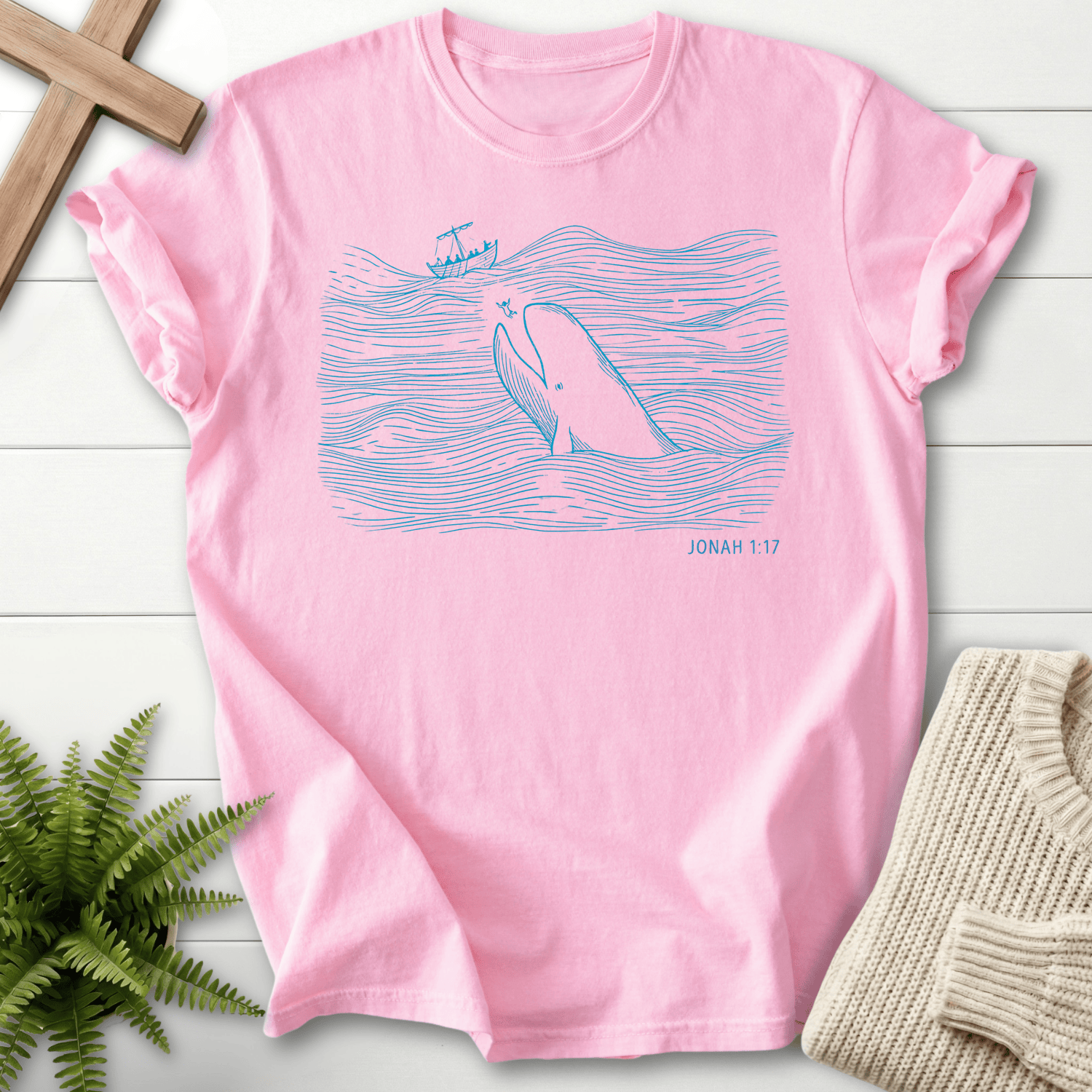 Blossom women's Christian t-shirt with a line-art whale surfacing from waves, inspired by Jonah 1:17