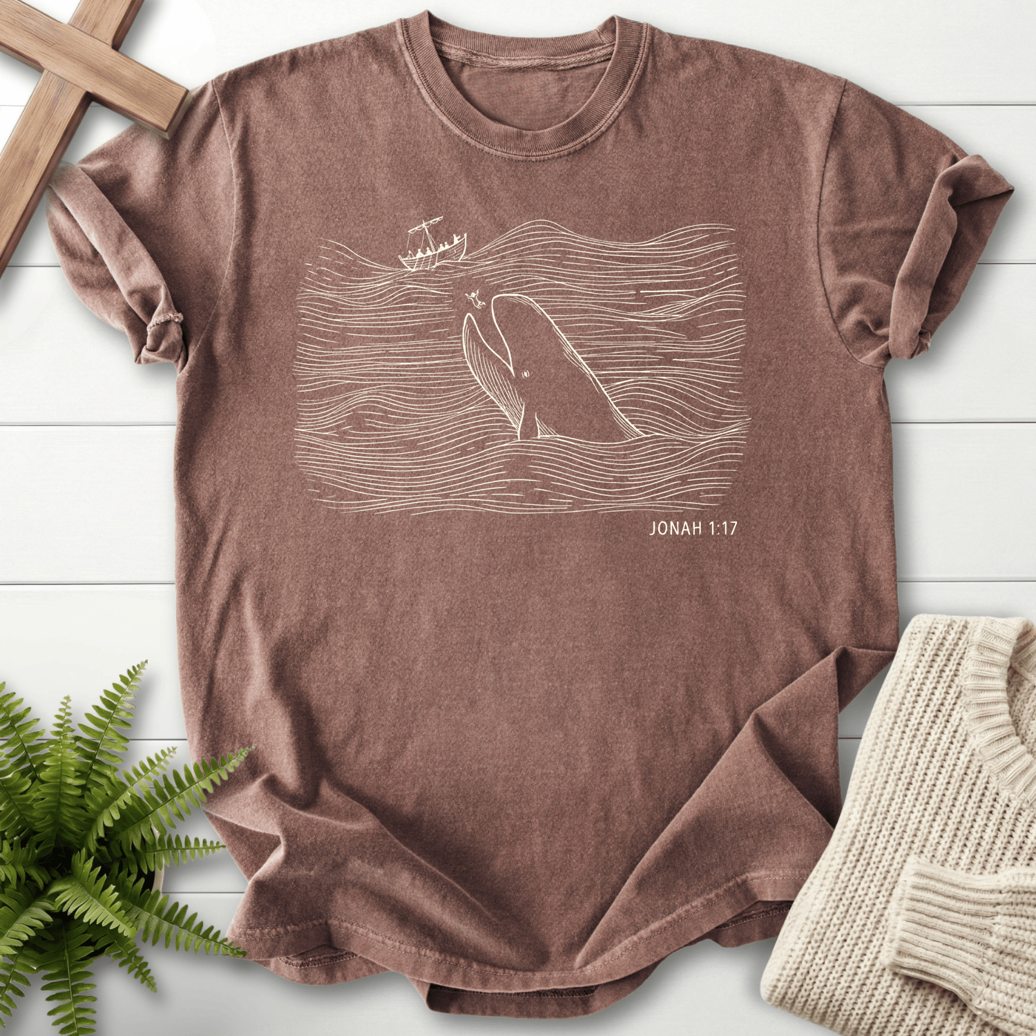 Espresso women's Christian t-shirt with a white line-art whale and wave illustration, inspired by Jonah 1:17