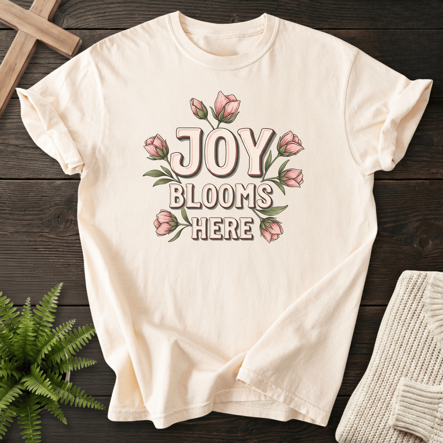 Ivory women's Christian t-shirt with "Joy Blooms Here" surrounded by pink tulip florals