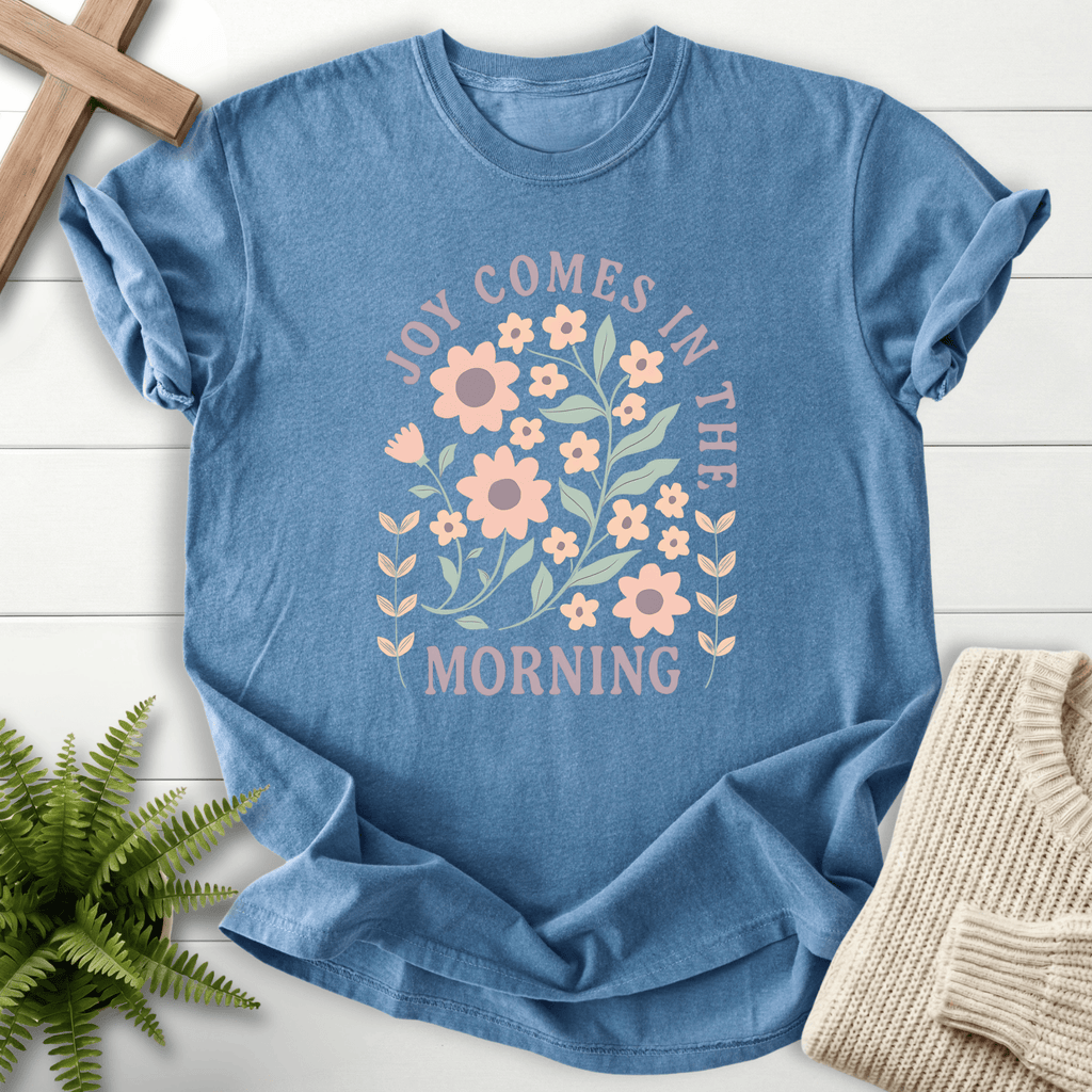 Blue Jean women's Christian t-shirt with a pastel daisy floral arch and "Joy Comes in the Morning"