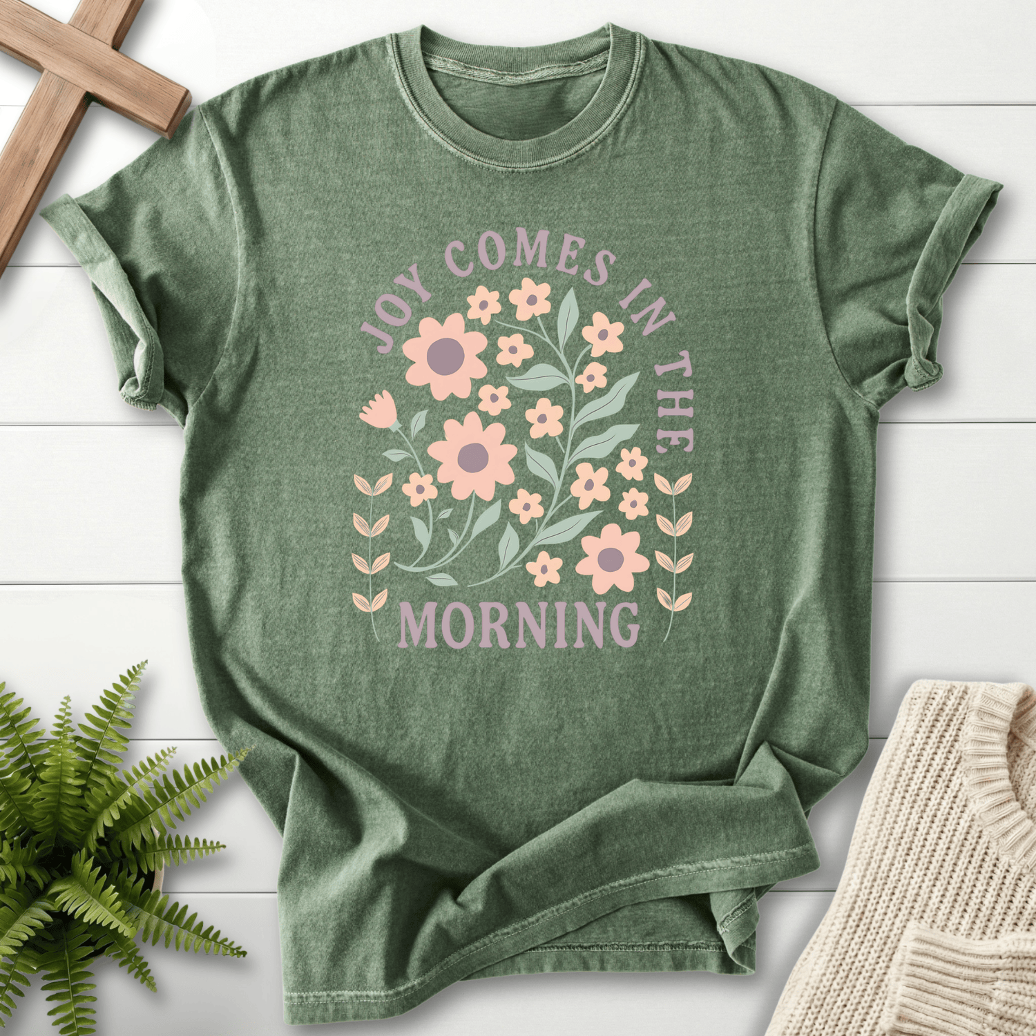 Moss women's Christian t-shirt with a pastel floral arch surrounding "Joy Comes in the Morning"