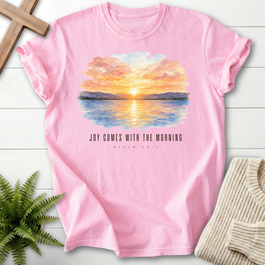 Flat lay of a Blossom Christian t-shirt for women featuring watercolor artwork with "Joy Comes With the Morning T-Shirt".