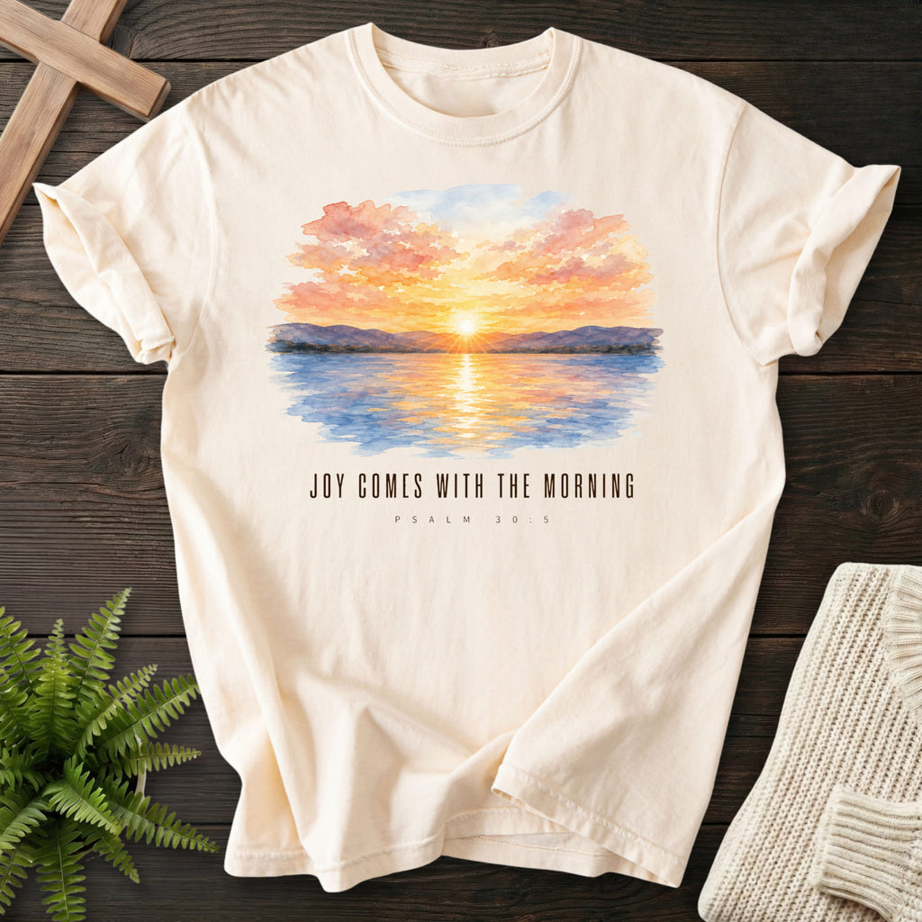 Ivory color option for the Joy Comes With the Morning tee with watercolor artwork with "Joy Comes With the Morning T-Shirt" for women's faith apparel.
